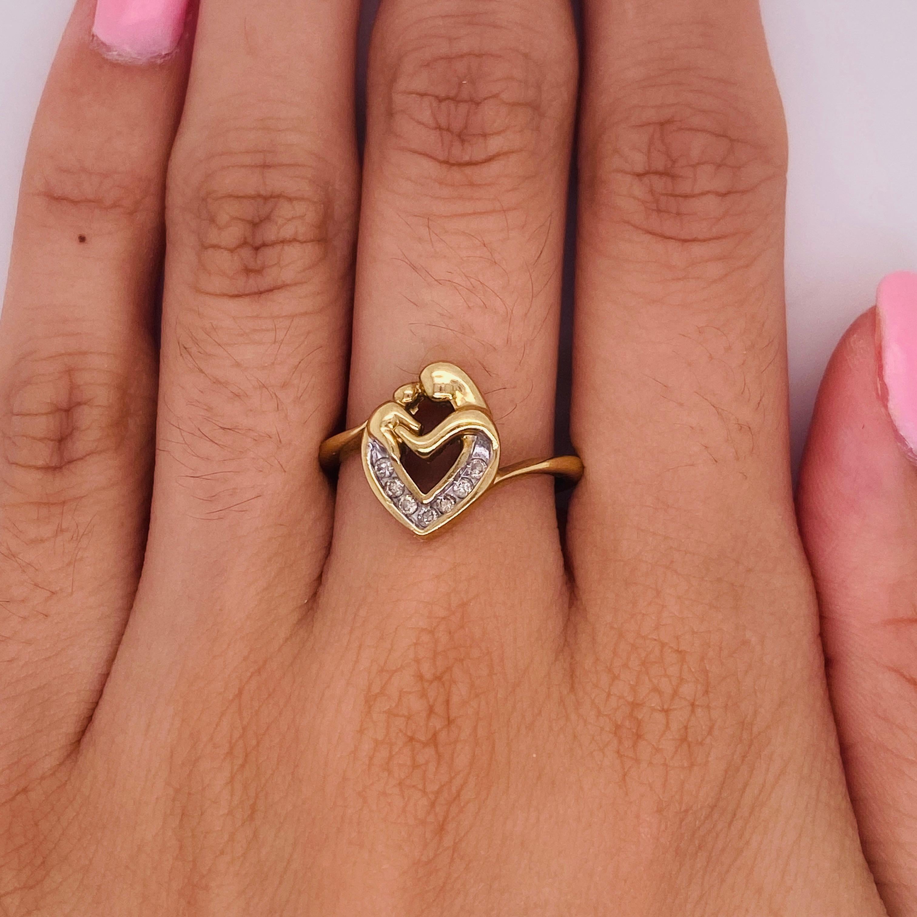 Celebrate the love of a mother and child with this sweet heart design ring. The band of the ring sweeps toward the top and bottom of the heart in a slender bypass style that makes the center design the primary focus. Make this ring the perfect gift