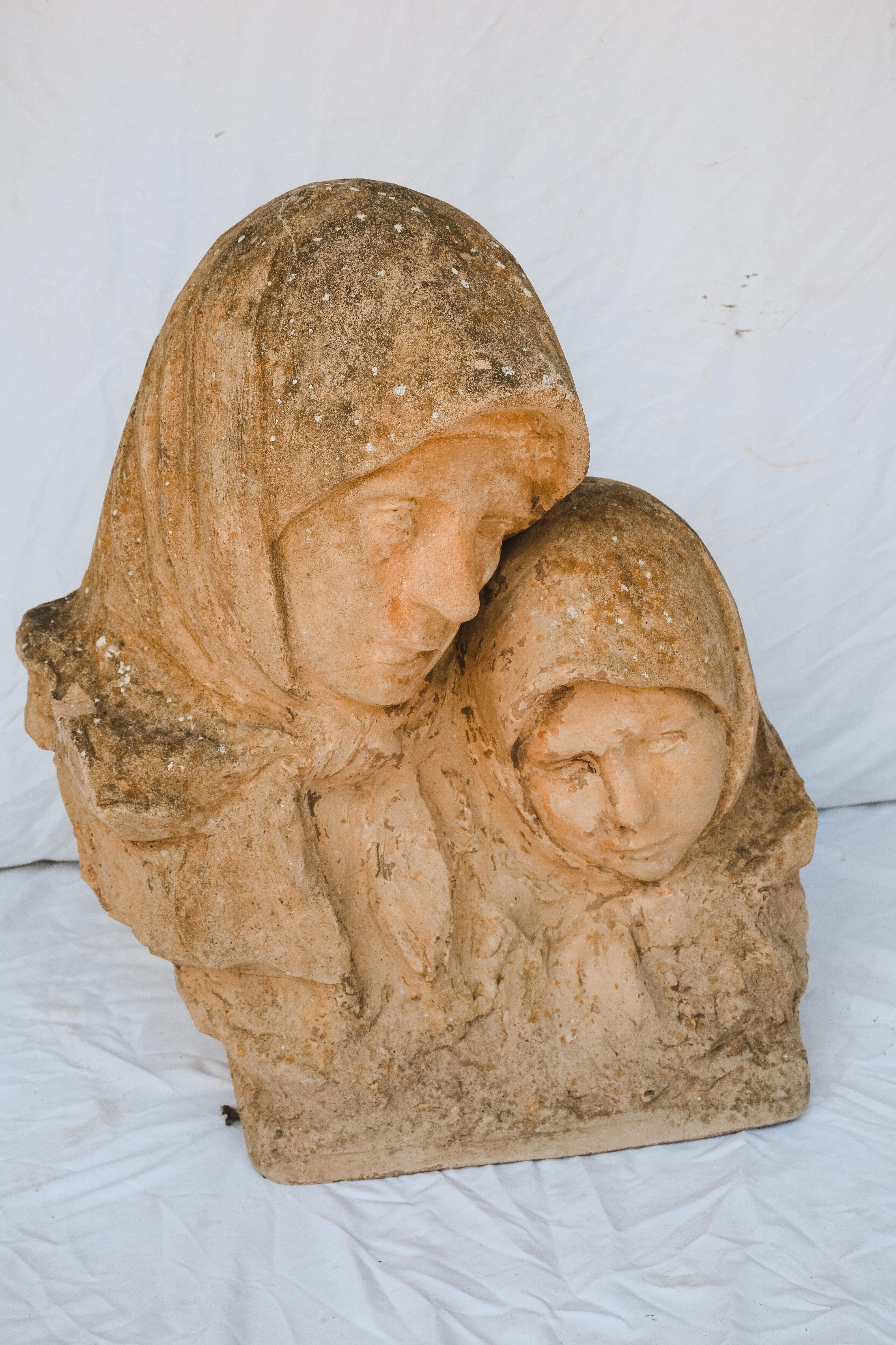 A beautiful Mother and Child statue from France. Placed in a garden or in a prominent spot it is sure to be a conversation piece.