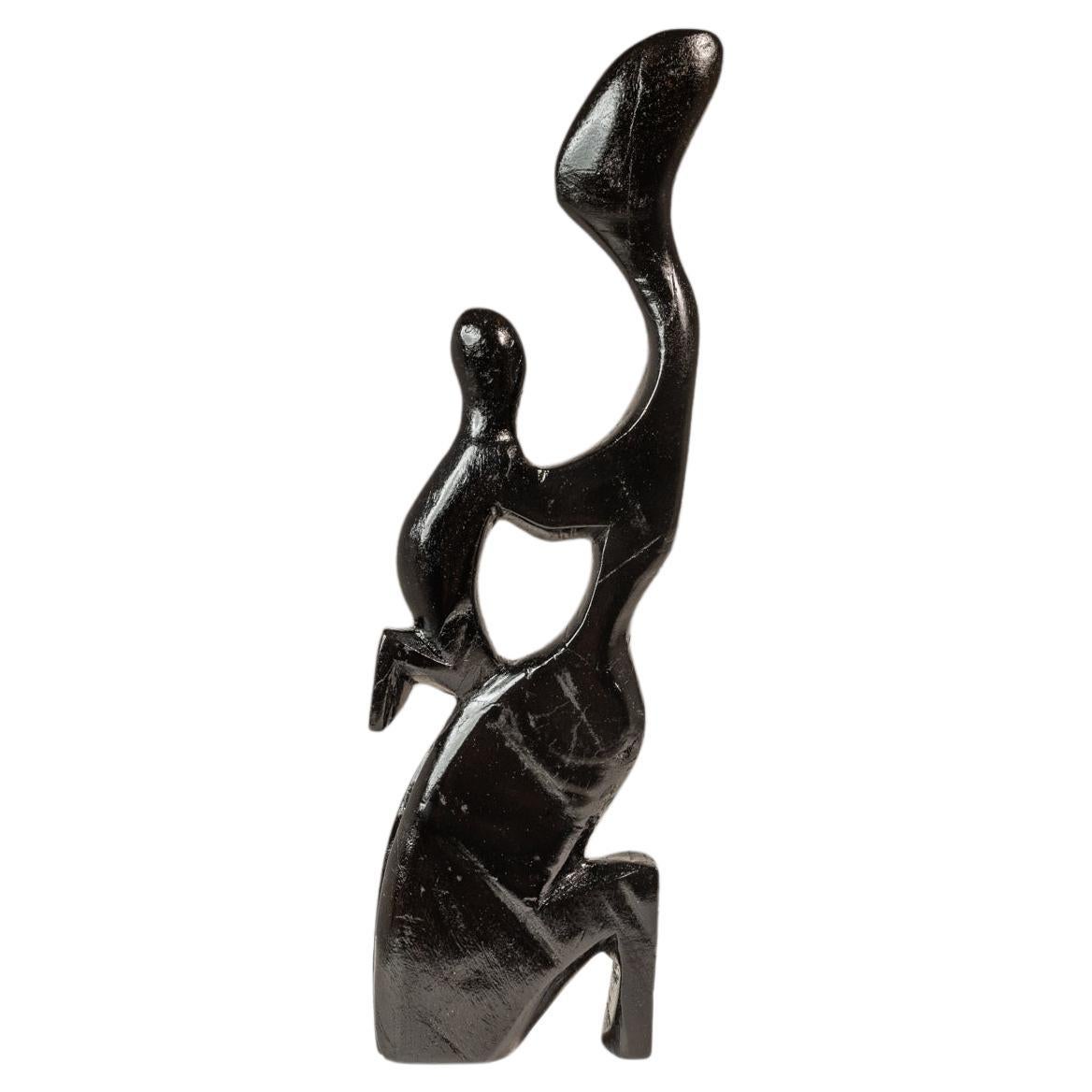 Sculpture humanoïde mère
Child sculptée dans de l
acajou, Afrique de l
Ouest, c.C. 1970