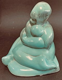 "Madre abrazando a su hijo", escultura de la era WPA en turquesa y carboncillo