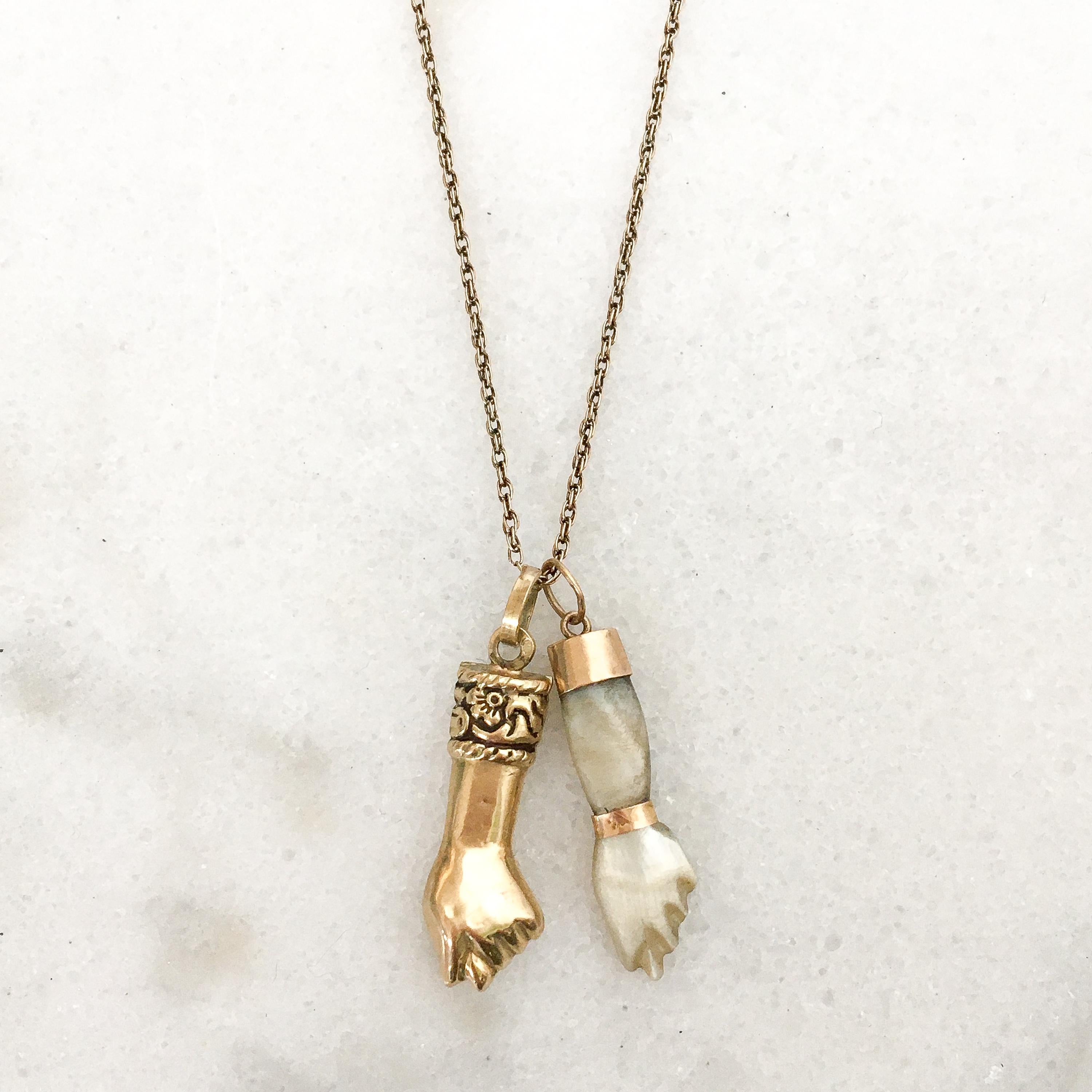 Mother of pearl, is an organic–inorganic composite material produced by some molluscs as an inner shell layer; it is strong, resilient, and iridescent. This vintage figa charm is made from beautiful mother of pearl. The hand has 14 karat yellow gold