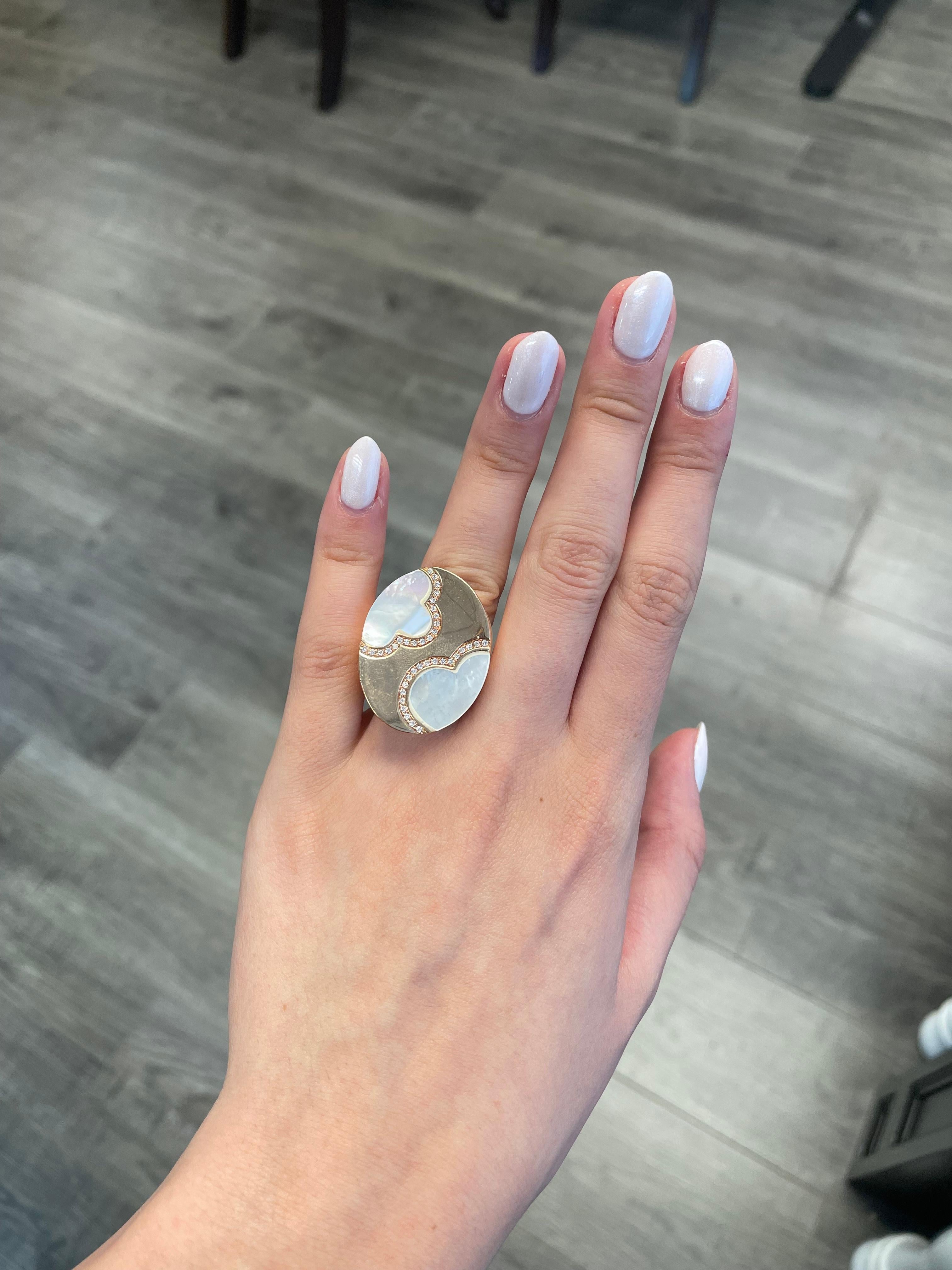 Exquisite custom carved mother-of-pearl with diamonds.
2 custom cut mother of pearls complimented by 0.26ct of round cut diamonds set in 18k rose gold.
Accommodated with an up to date appraisal by a GIA G.G. upon request. please contact us with any