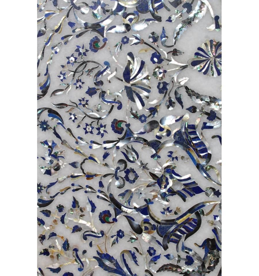 Handcrafted mosaic tabletop in the Italian Pietre Dure marble and semiprecious stones inlay technique.

Detailed classical Baroque Rococo ornamental design over a round white Carrara marble tabletop inlaid with precious mother-of-pearl and lapis