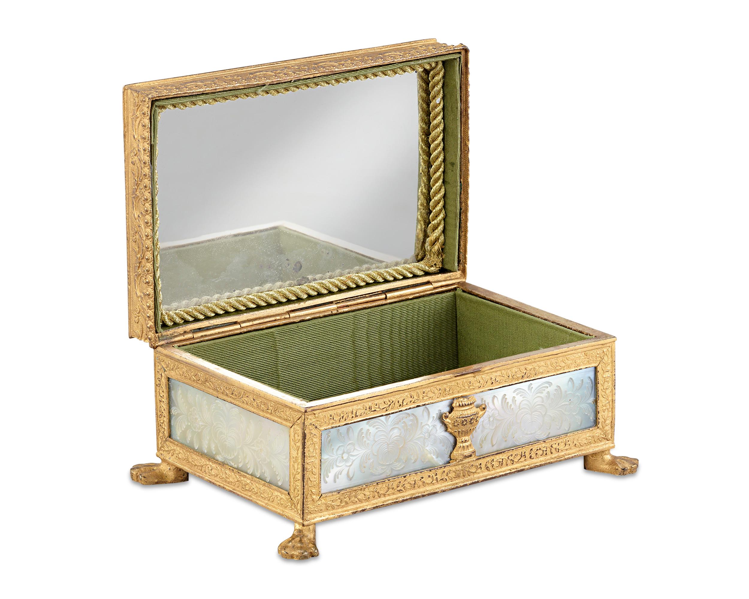 This beautiful French Palais Royal box is an outstanding treasure inside and out. A gem of the Restoration period, this delicate box is crafted of mother-of-pearl, mounted in fine doré bronze and intricately engraved in a floral motif. Boxes sold in