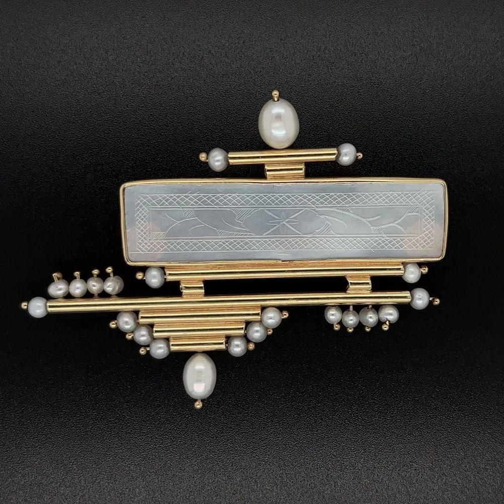 Simply Beautiful! Mother of Pearl and Pearl Gambling Chip Tubular Gold Modern Design Statement Brooch. Centering a securely Hand set MOP Gambling Chip, accented with Pearls. Beautifully Hand crafted in 14K Yellow Gold. Measuring approx. 2.4