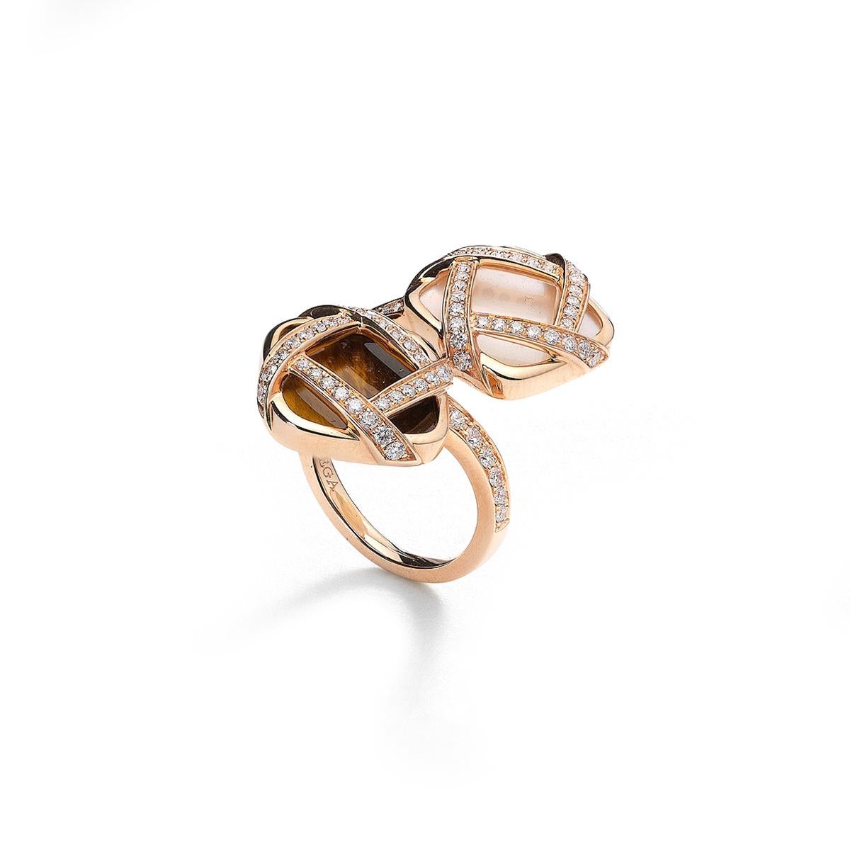 Ring pink gold 18K set with 76 diamonds 0.86 cts, one mother of pearl 3.41 cts and one tiger eye 3.29 cts.               