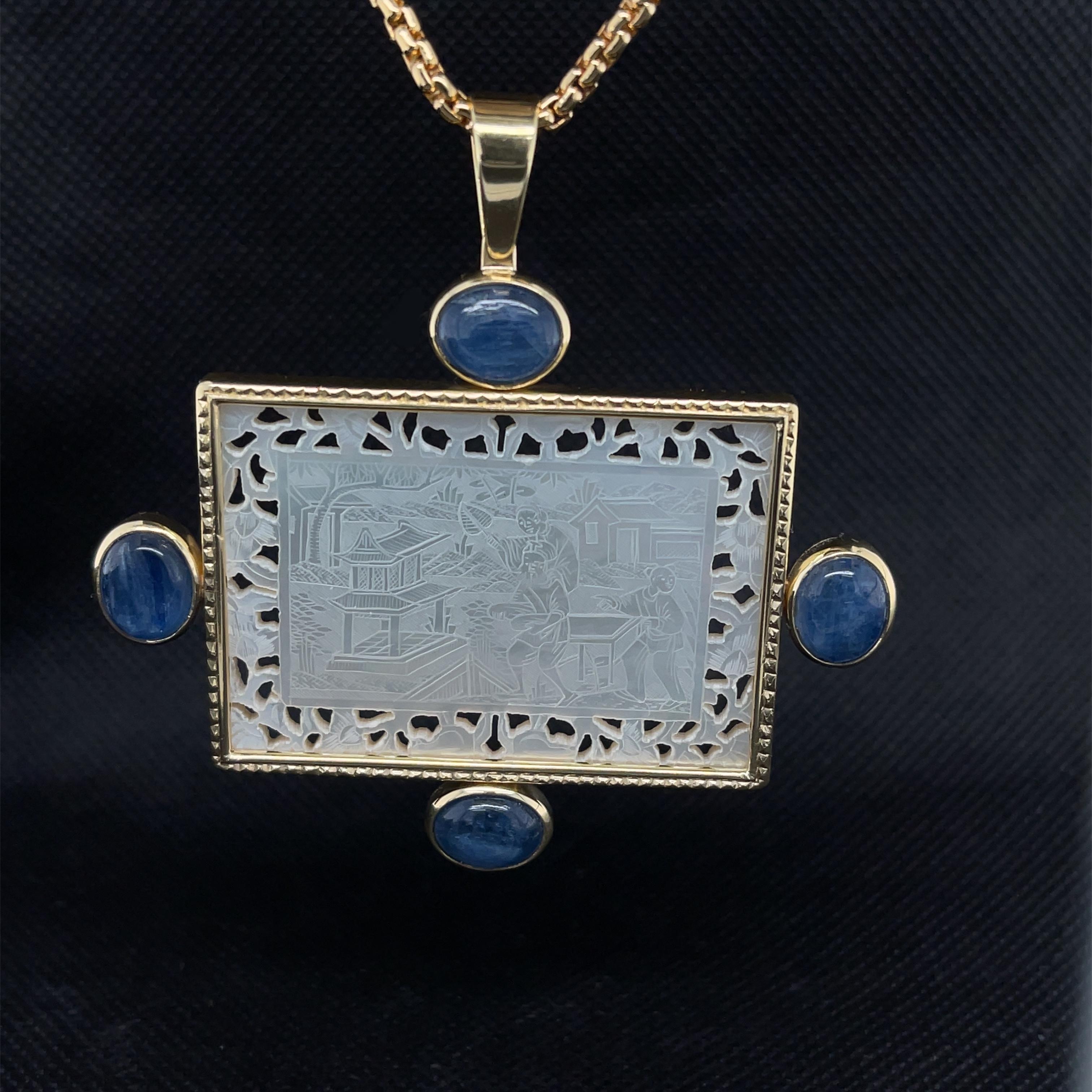 This gorgeous pendant features a large, rectangular antique mother-of-pearl gaming counter set in 18k yellow gold. Mother-of-pearl gaming counters were originally carved in China for export to Britain, where they were used as gambling chips, much
