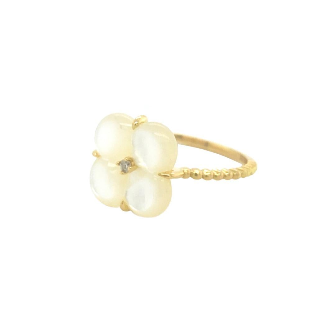 18K yellow gold mother of pearl clover design diamond ring is an exquisite piece of jewelry that seamlessly blends elegance with a touch of whimsy.
Crafted from high-quality 18-karat yellow gold, the ring showcases a delicate clover design adorned