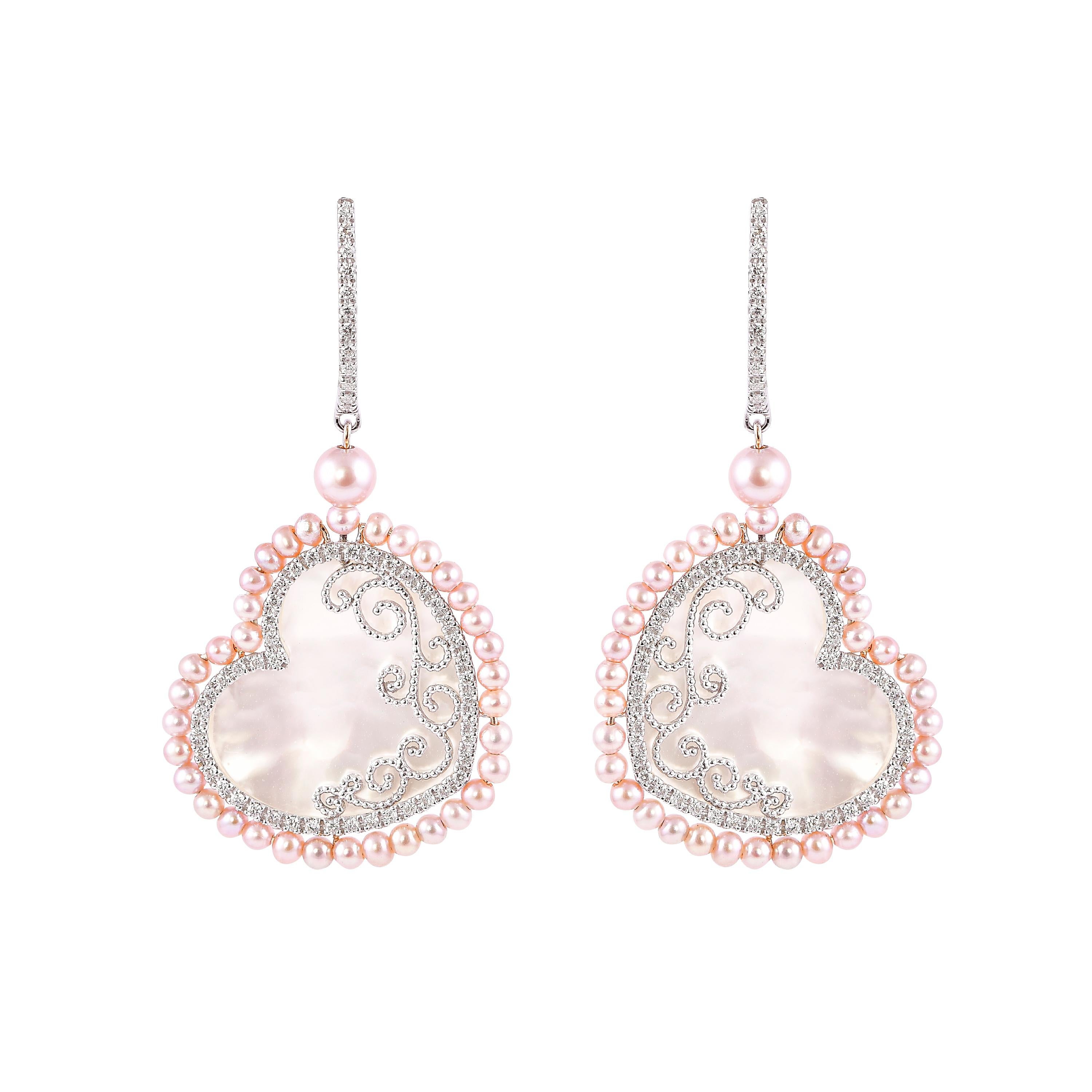 An exclusive collection of designer and unique dangle earrings by Sunita Nahata Fine Design. 

Mother of Pearl Dangle Earring in 18 Karat White Gold.

Mother of Pearl: 5.47 carat, Fancy Shape.
Pink Pearl: 4.69 carat, 2.00 Size, Ball Shape.
Pink