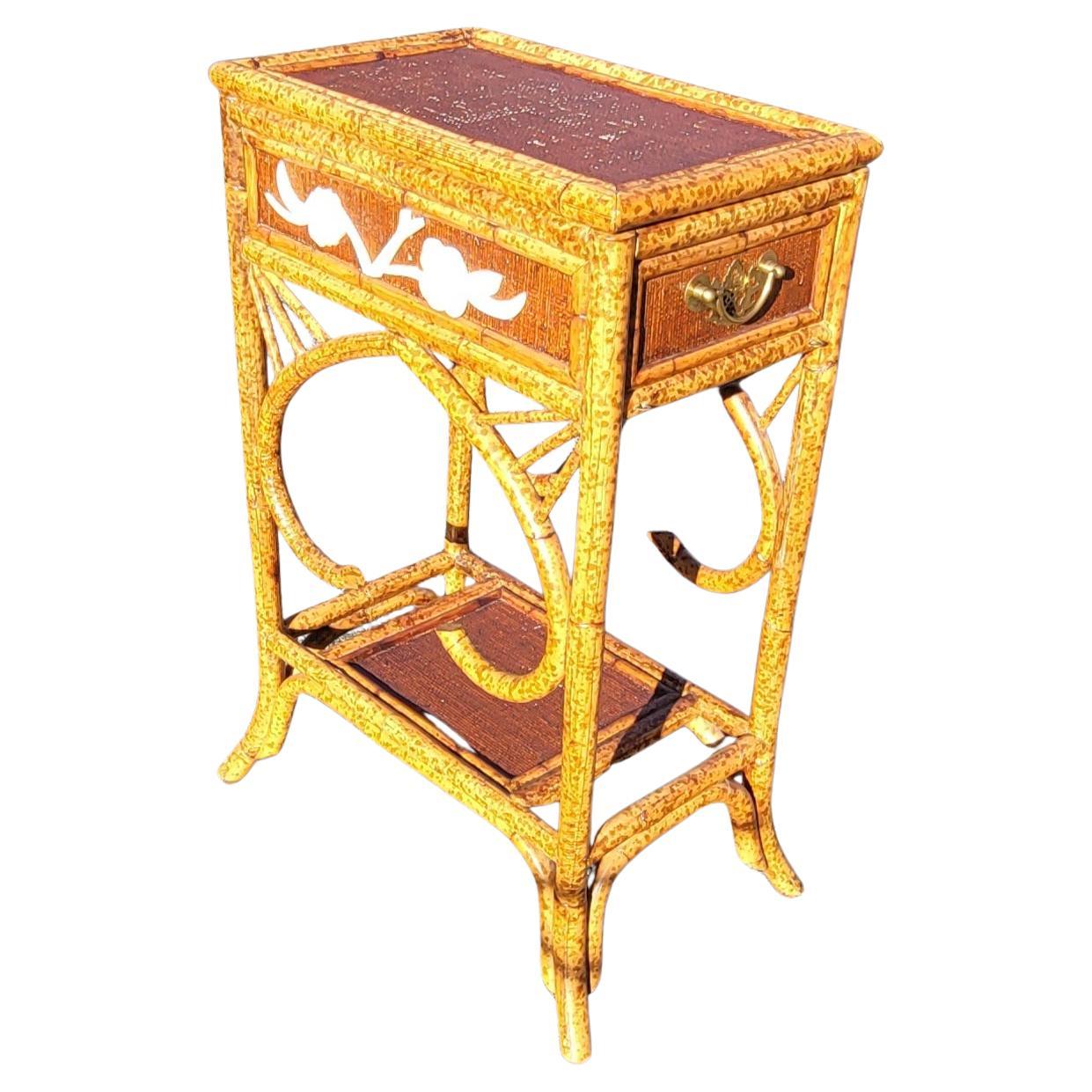 A sunning Mother-of-Pearl Decorated Rattan Flip Top side table cabinet in good vintage condition measuring 18.5