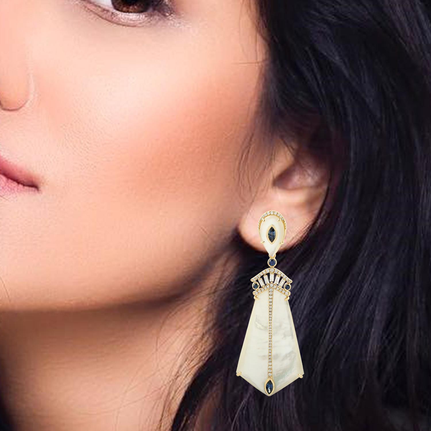Cast in 18-karat gold, these beautiful earrings are set with 51.25 carats mother of pearl, 1.7 carats Sapphire and 1.23 carats of glimmering diamonds. 

Please note that carat weights may slightly vary as each Meghna Jewels creation is handmade.