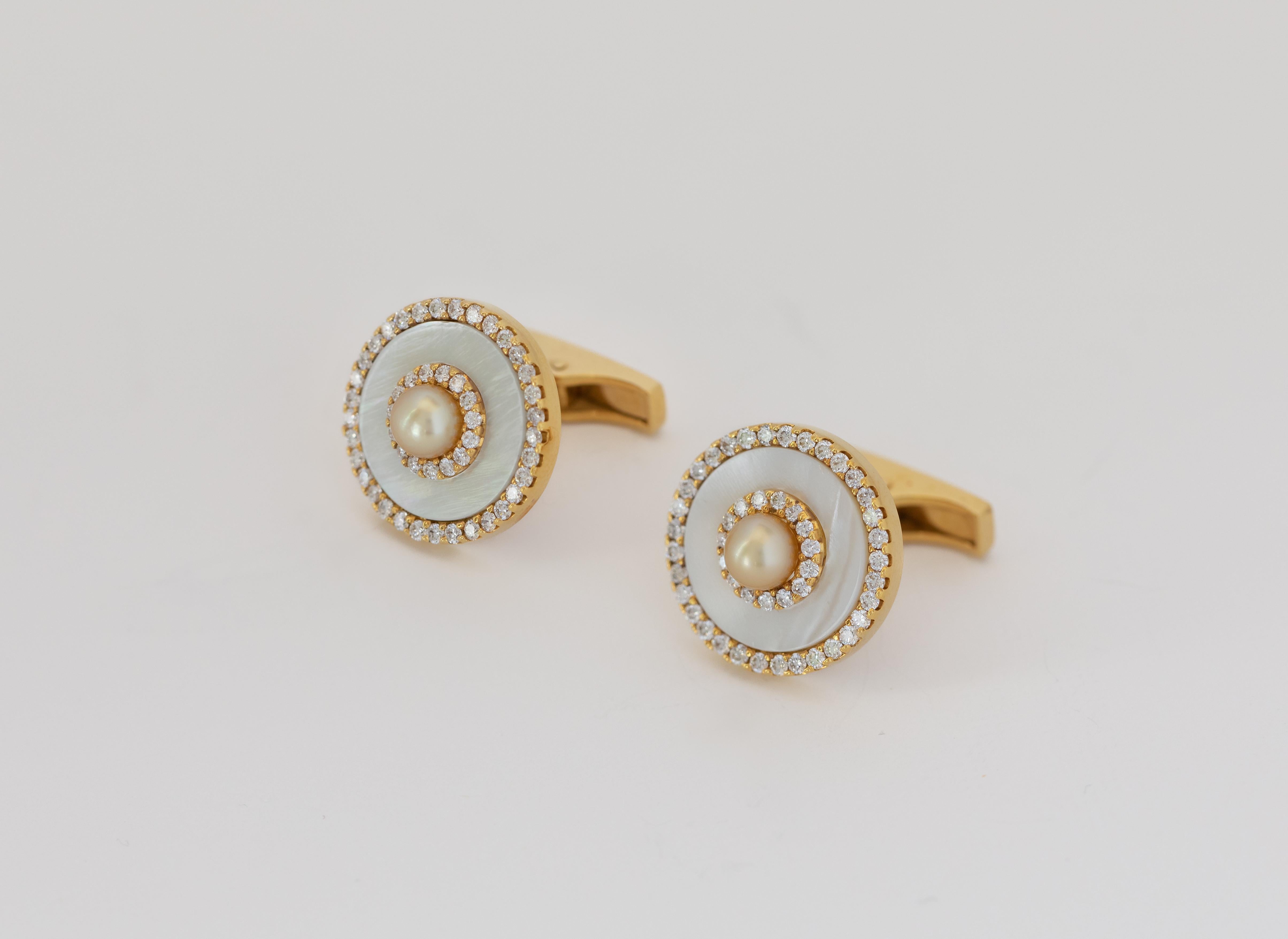 From the Mattar Jewelers cufflinks collection - diamonds and yellow gold encircle mother of pearl discs. Natural pearls are the centermost feature.

The cufflinks are designed and crafted in Bahrain.
The pearls are certified from the Gem and Pearl