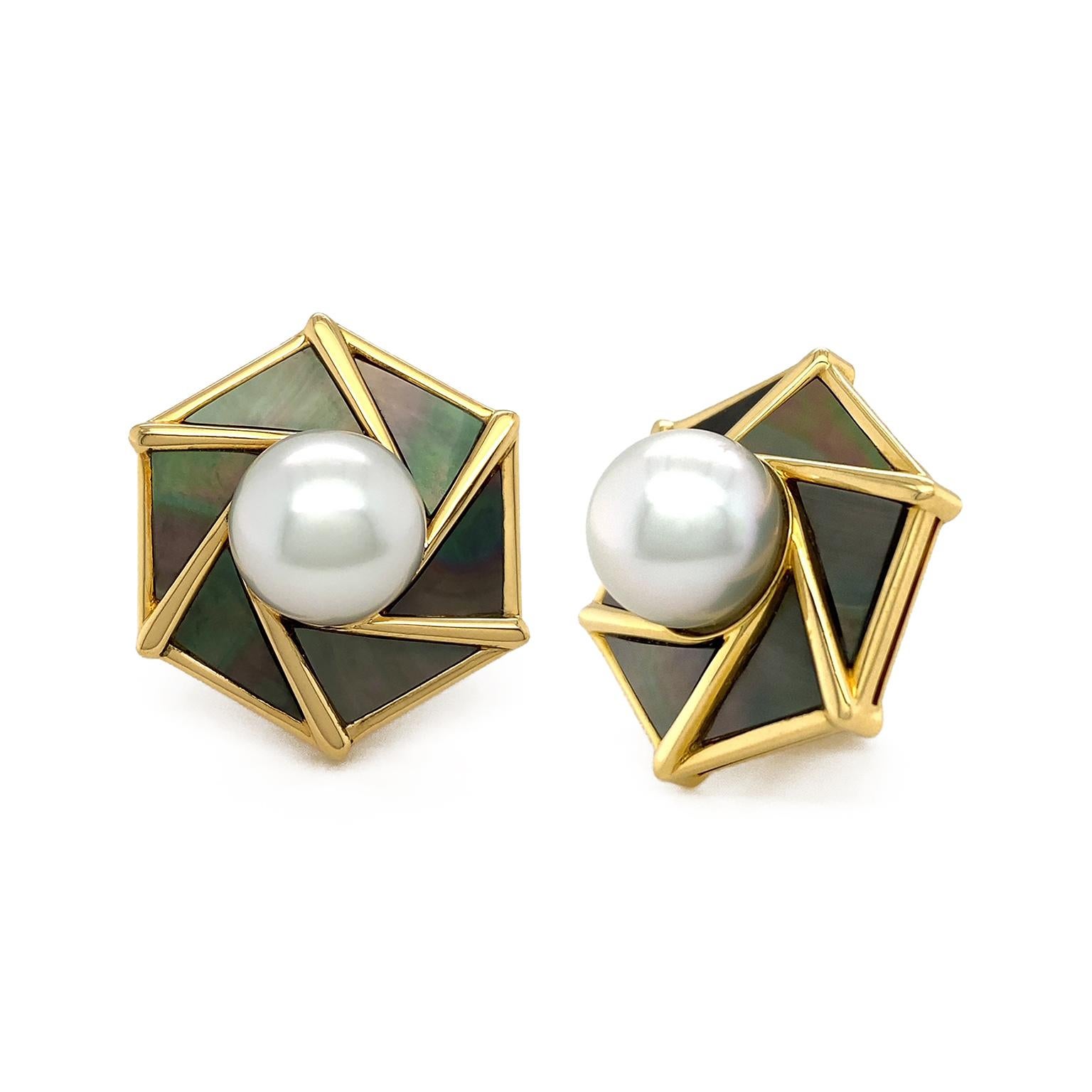 Prismatic black mother of pearl encompasses a white pearl for these earrings. 18k yellow gold strands outline the edges, as well as where each specially cut mother of pearl meet. Black mother of pearl is formed on the interior of oyster shells by