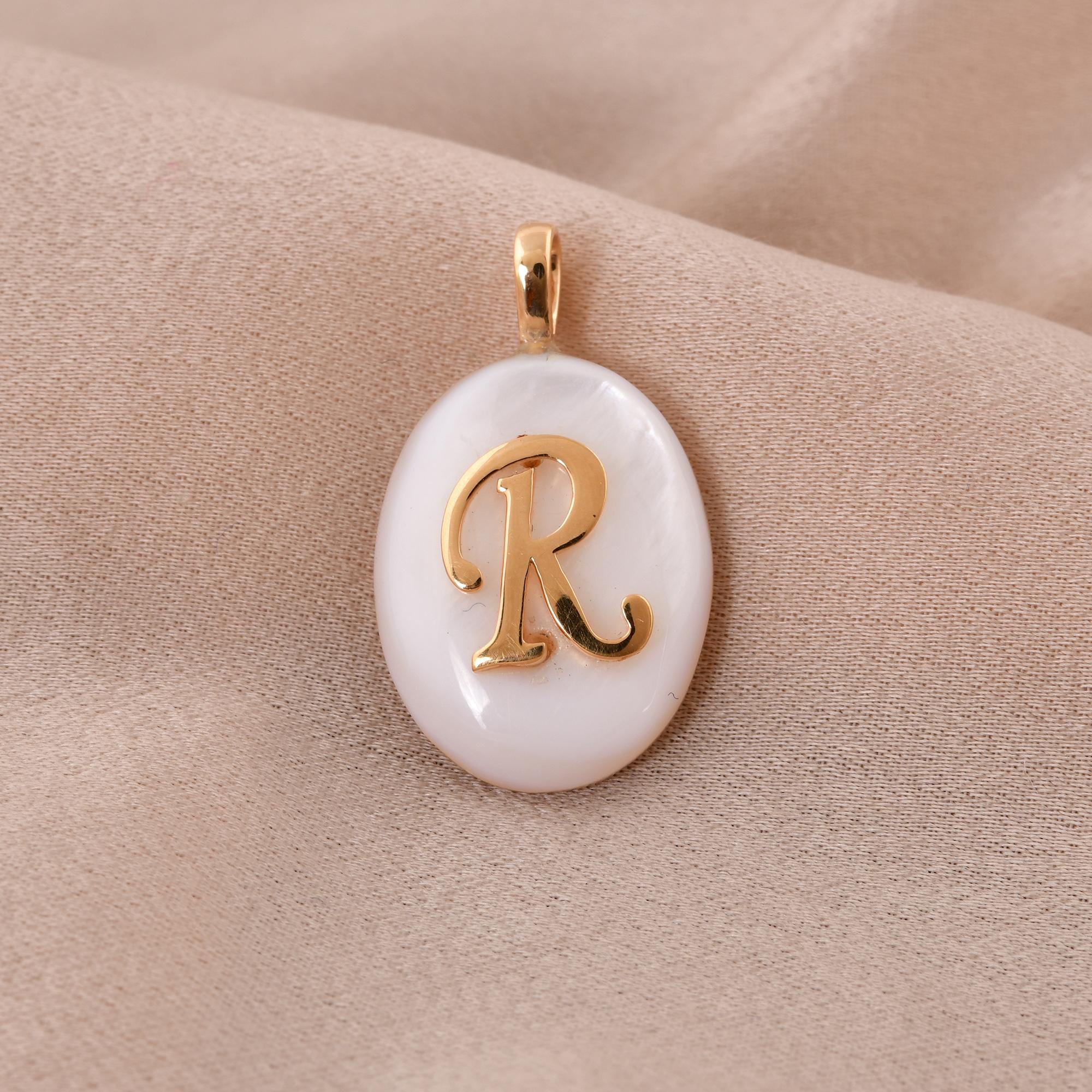 Crafted from luxurious 18 karat yellow gold, this pendant boasts a warm and radiant hue that complements the shimmering beauty of the Mother of Pearl gemstone. The rich tone of the gold adds a touch of opulence to the piece, making it a luxurious