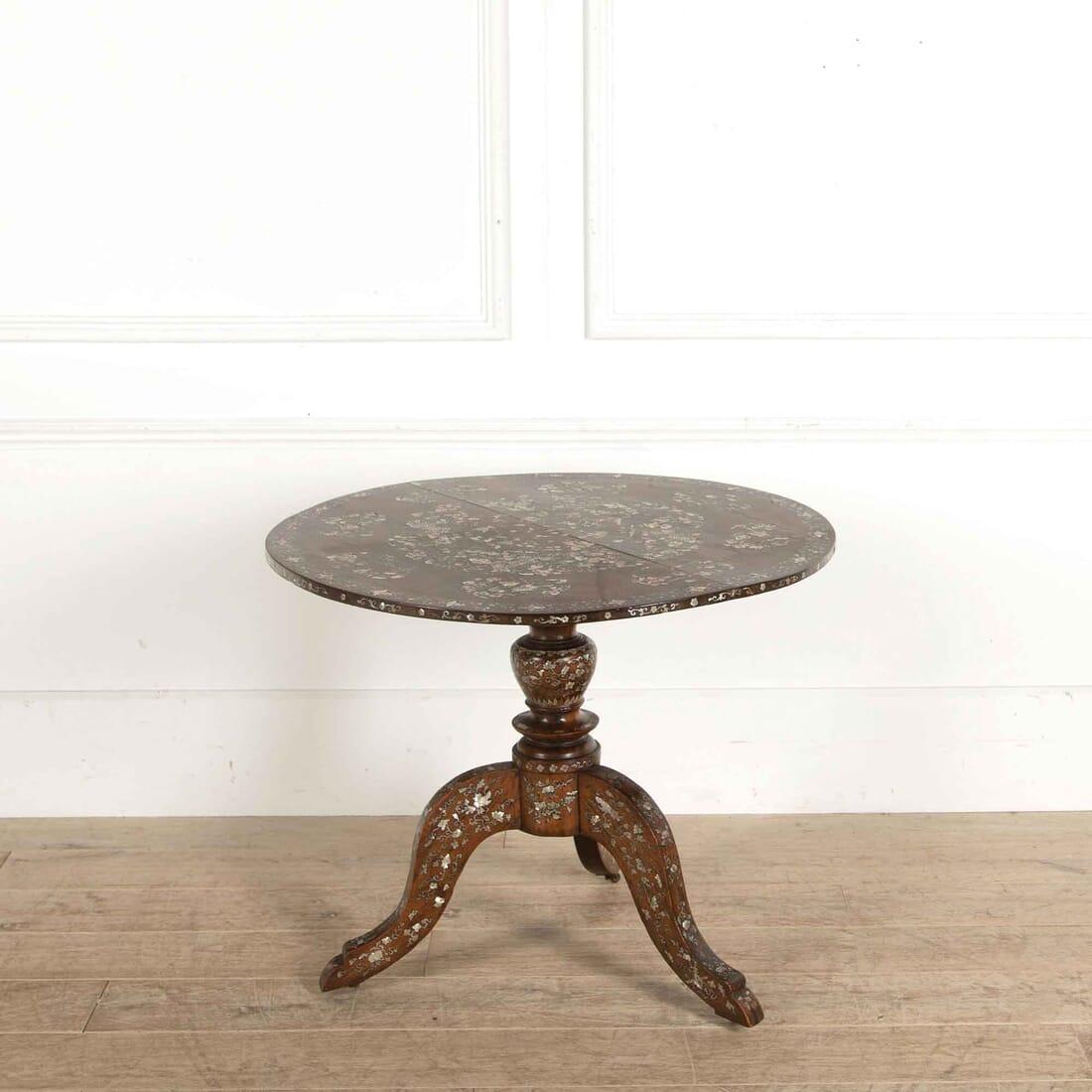 A striking Anglo-Chinese tripod table with mother of pearl inlay to the top and base circa 1880.