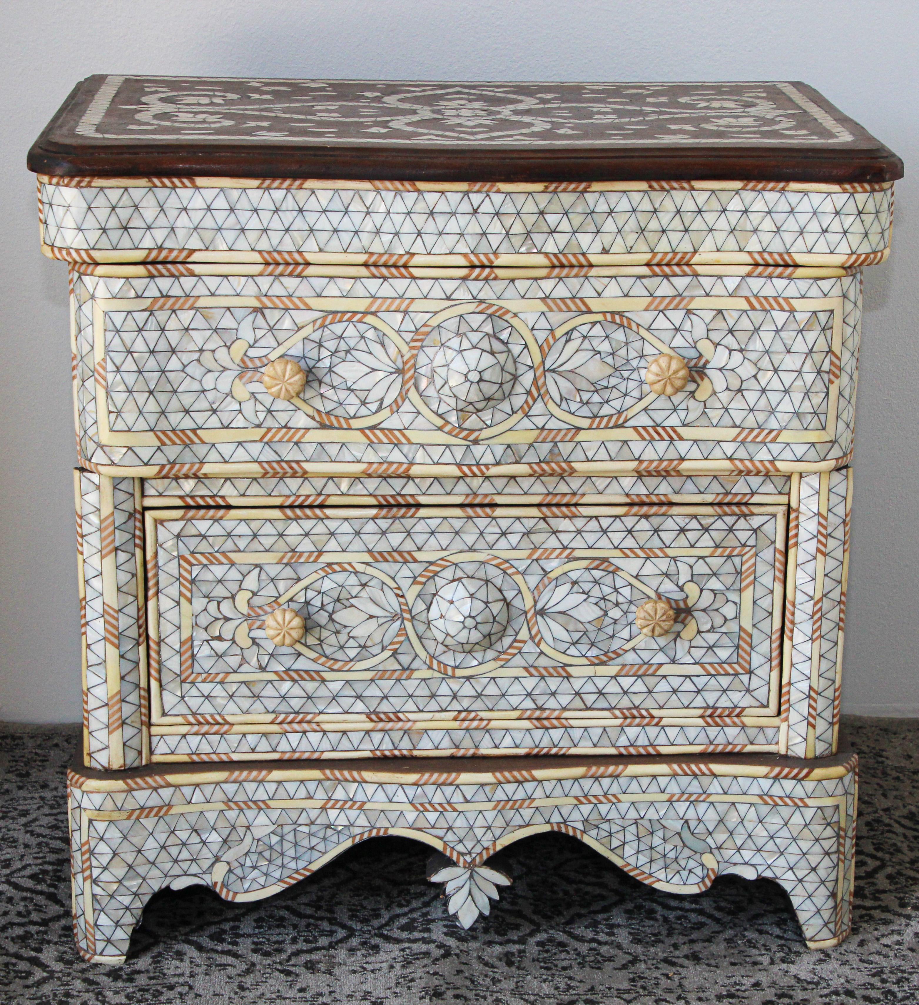 Fabulous Middle Eastern Syrian style Moroccan nightstand.
Handcrafted contemporary Moroccan dresser with two drawers, wood inlay with white mother of pearl.
Moorish arches and intricate Islamic designs.
Dowry chest of drawers heavily inlaid in