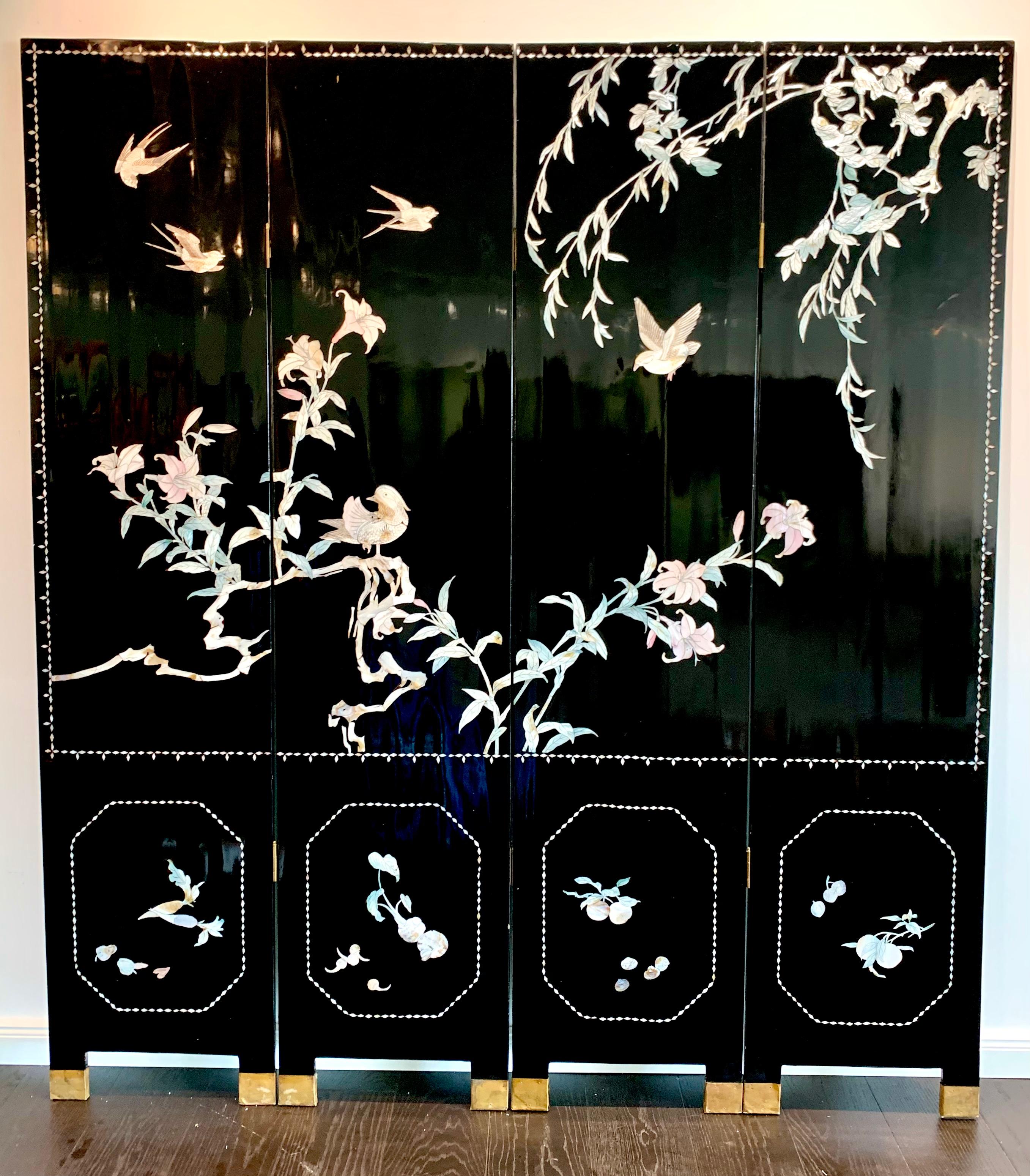 Beautiful and rare black 19th century Paravent with mother of pearl inlays and gold painting on the back. The stunning inlay depict birds on trees.
The room divider has four panels and is made out of wood, painted and with mother of pearl inlays.