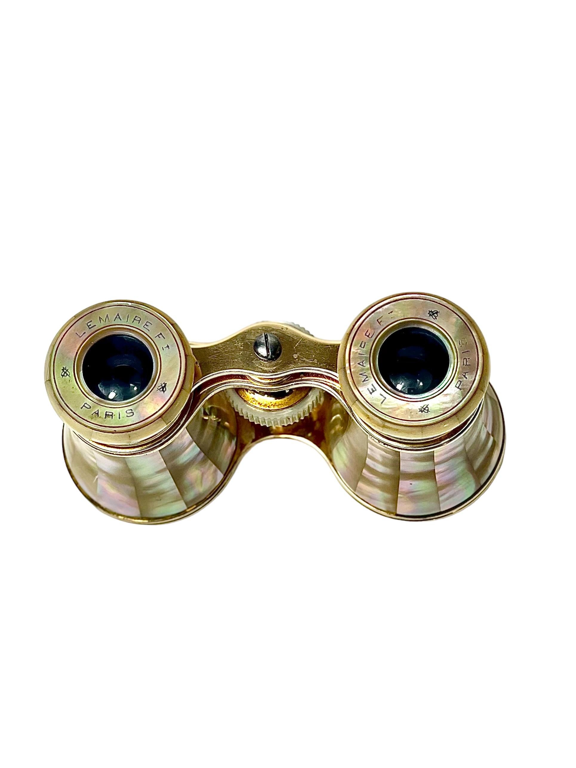 A beautiful pair of miniature binoculars, or opera glasses, crafted from brass and clad in iridescent mother of pearl inlaid panels. Dating from the late 19th century, these were made by renowned craftsman Jacques LeMaire, who is credited with the