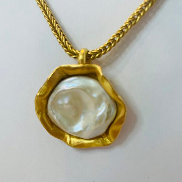 Exquisite Mother of Pearl Pendant set in a bed of 22k gold! Beautiful, elegant, and finished with a 16