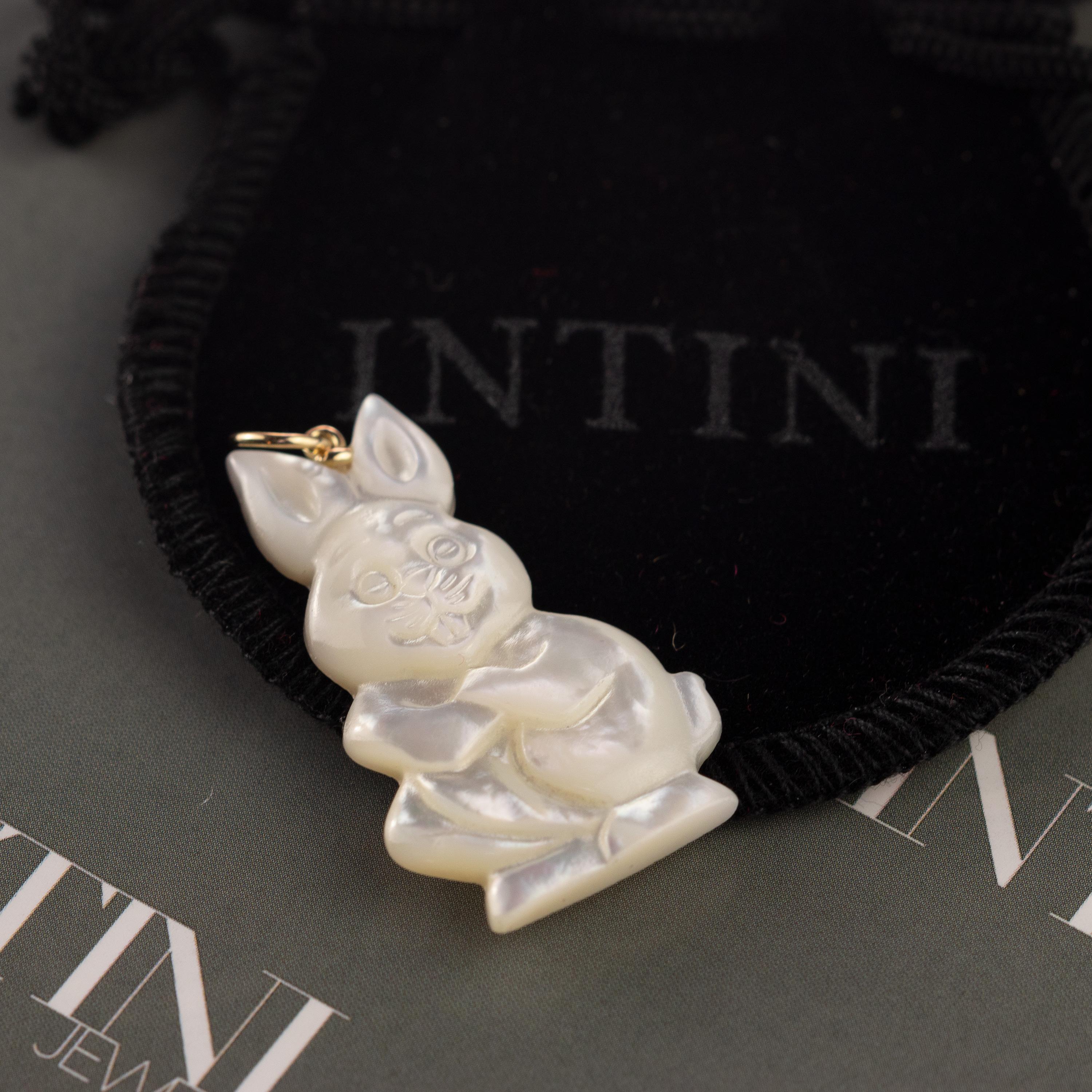 Stunning unique easter piece. Mother of pearl pendant with an amazing rabbit / bunny shaped form. Marvelous jewel with 18 karat yellow gold setting.

Mother of Pearl brings the gentle healing power of the sea. It is a stress relieving stone;