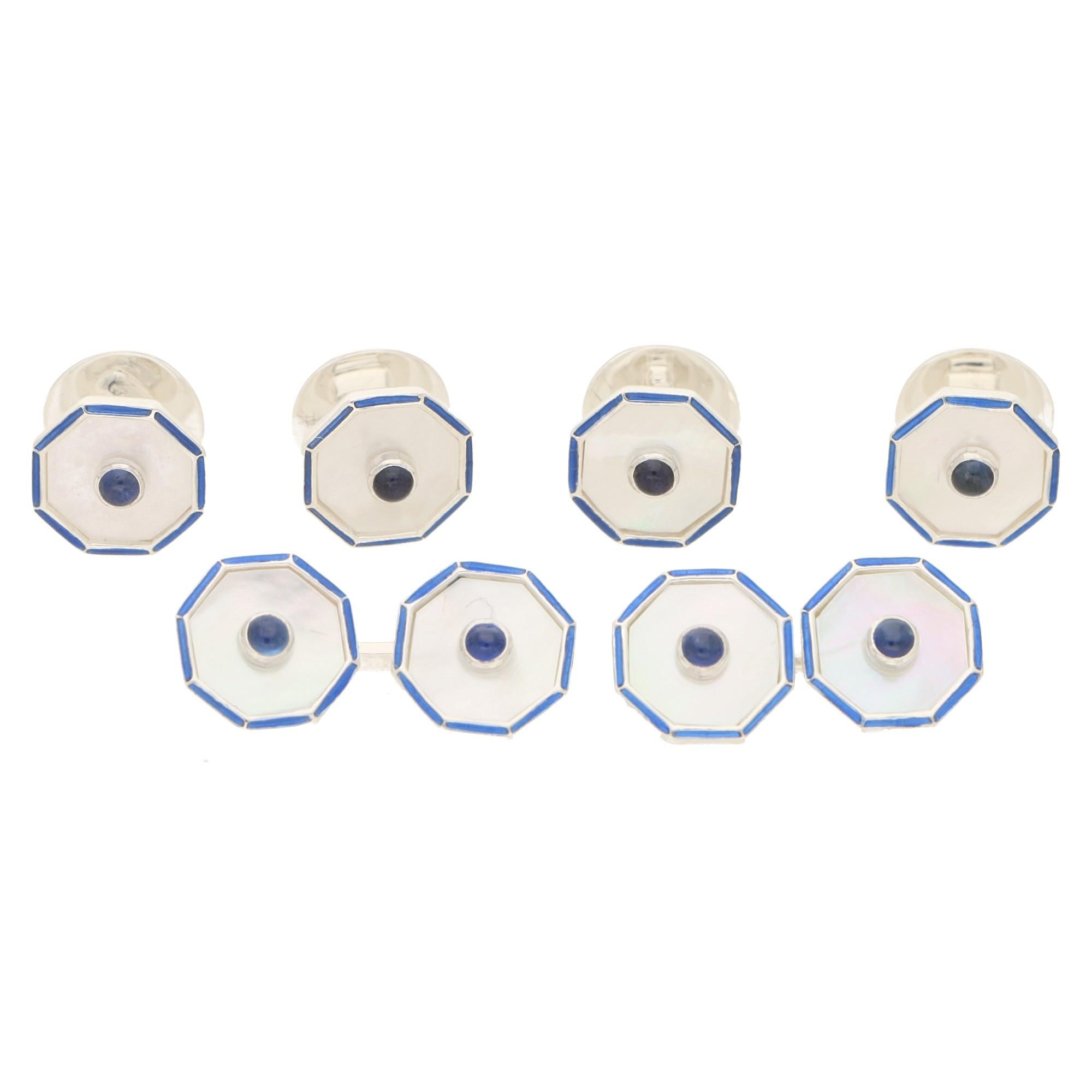 A sophisticated set of mother-of-pearl, sapphire and enamel cufflinks and matching shirt studs in solid silver. Each set is comprised of four shirt studs and a pair of cufflinks and are each shaped octagonally. Each octagonal head is formed of a