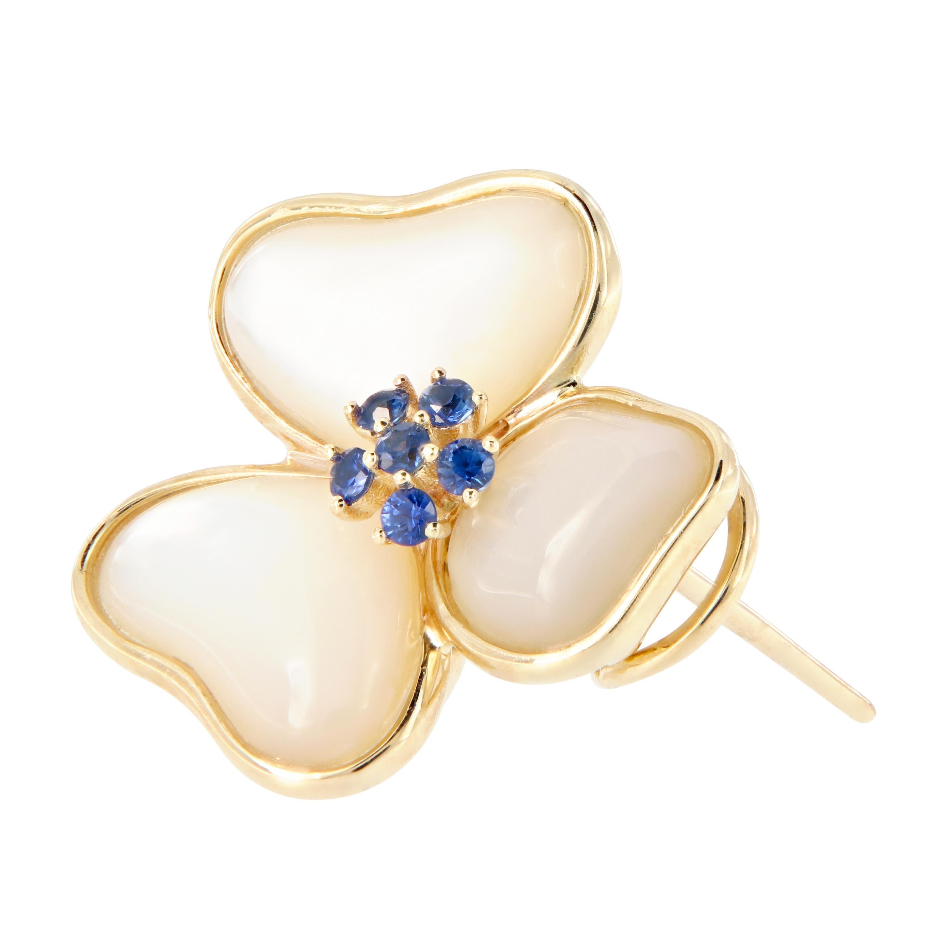 Pretty mother of pearl petals with 14k yellow gold trim and a central pistil set with blue sapphires. Weigh 8.6. Earrings are 20.5mm x 20.4mm.

Blue Sapphires 0.34 cttw