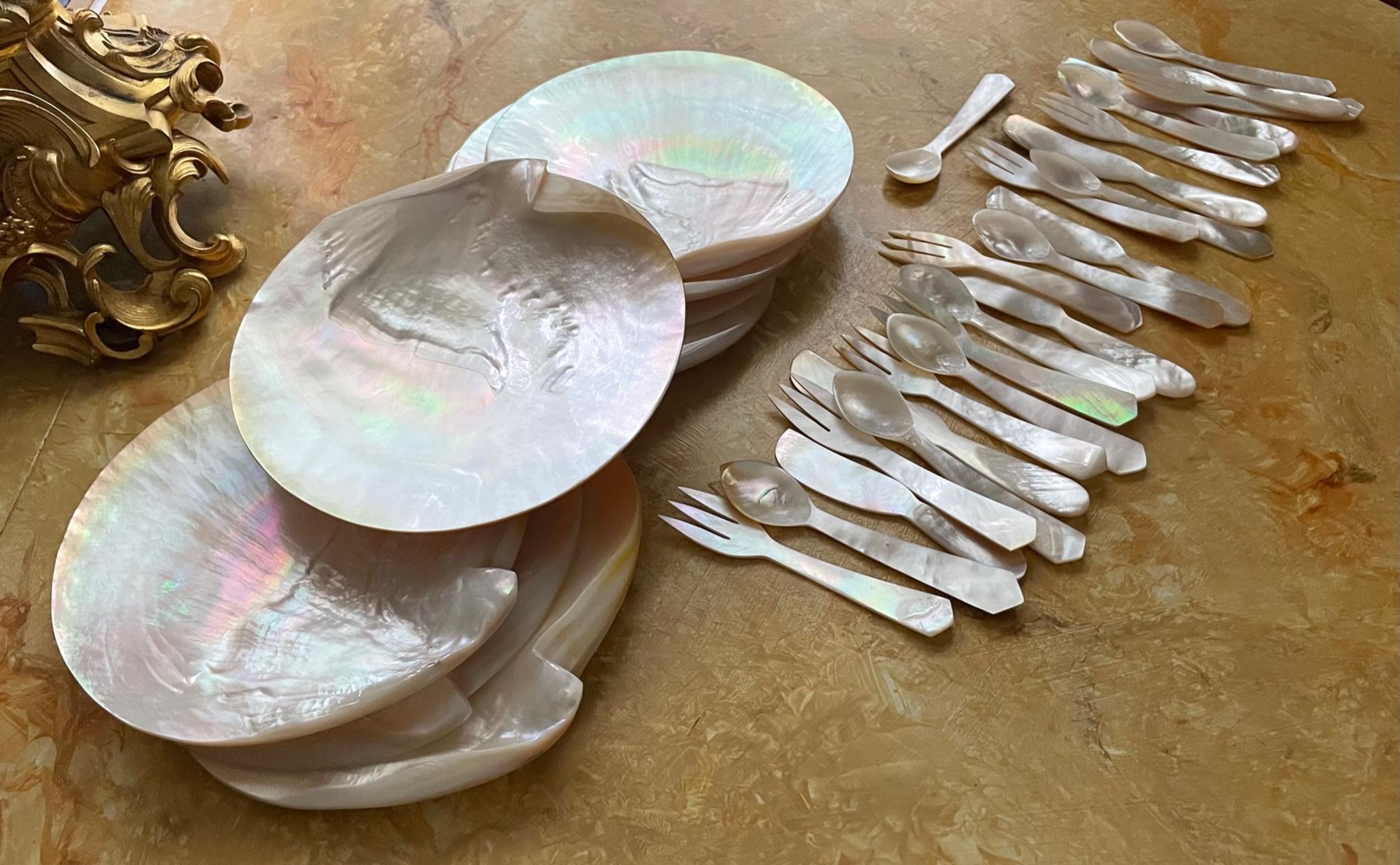 Mother of Pearl seashell Caviar dish with Cutlery. 8 complete sets. 

Rare set of eight caviar plates of polished mother of pearl. Each plate has a set with spoon, fork and knife. The plates, with iridescent luster and shine, are one of nature’s