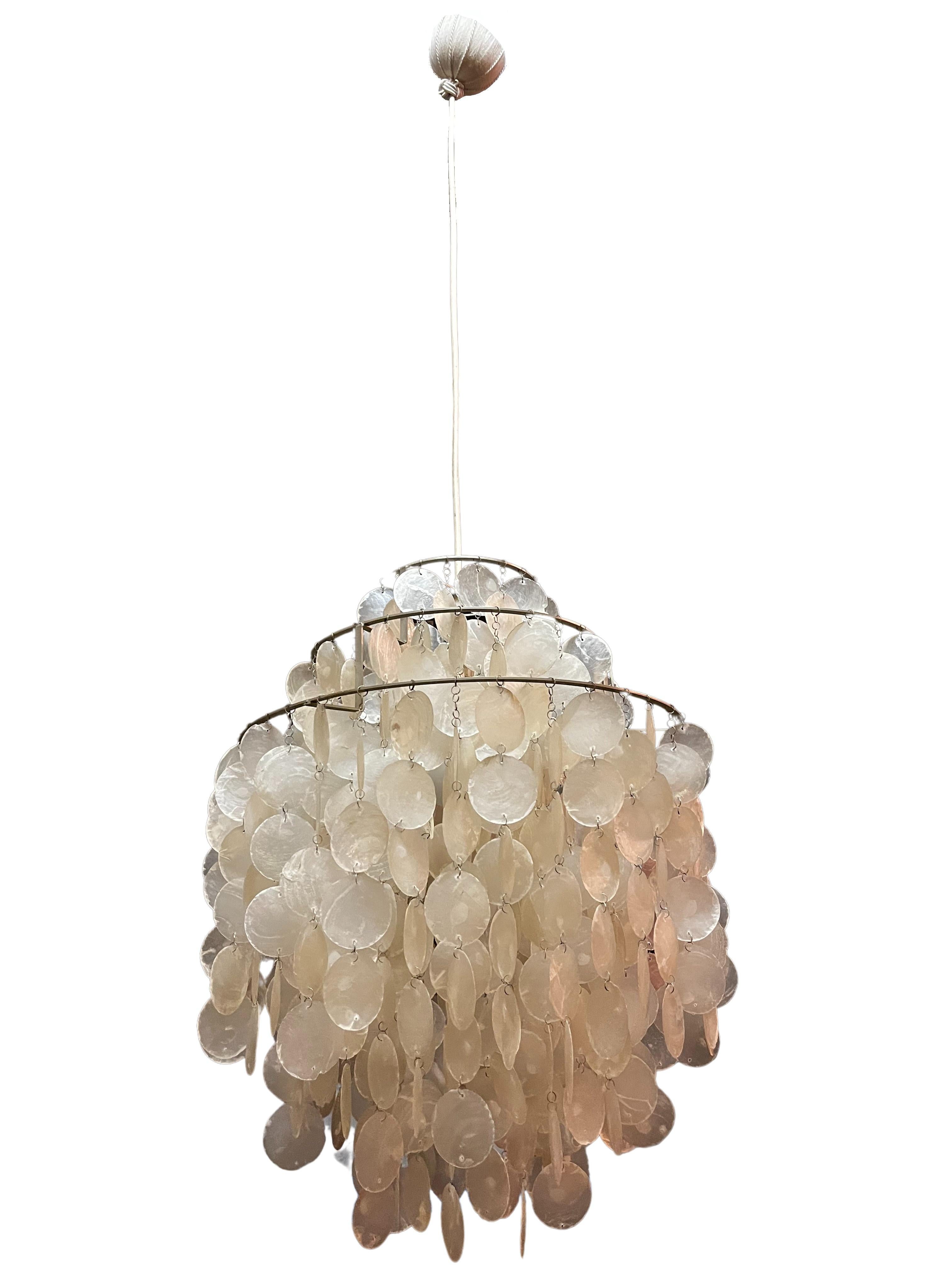 Fantastic hanging lamp, Fun 0DM, a rare original from the 1960s, by the famous designer Verner Panton from Denmark.

The 3 metal rings are covered all over with round shell plates that are attached with small metal rings. This creates a wonderful