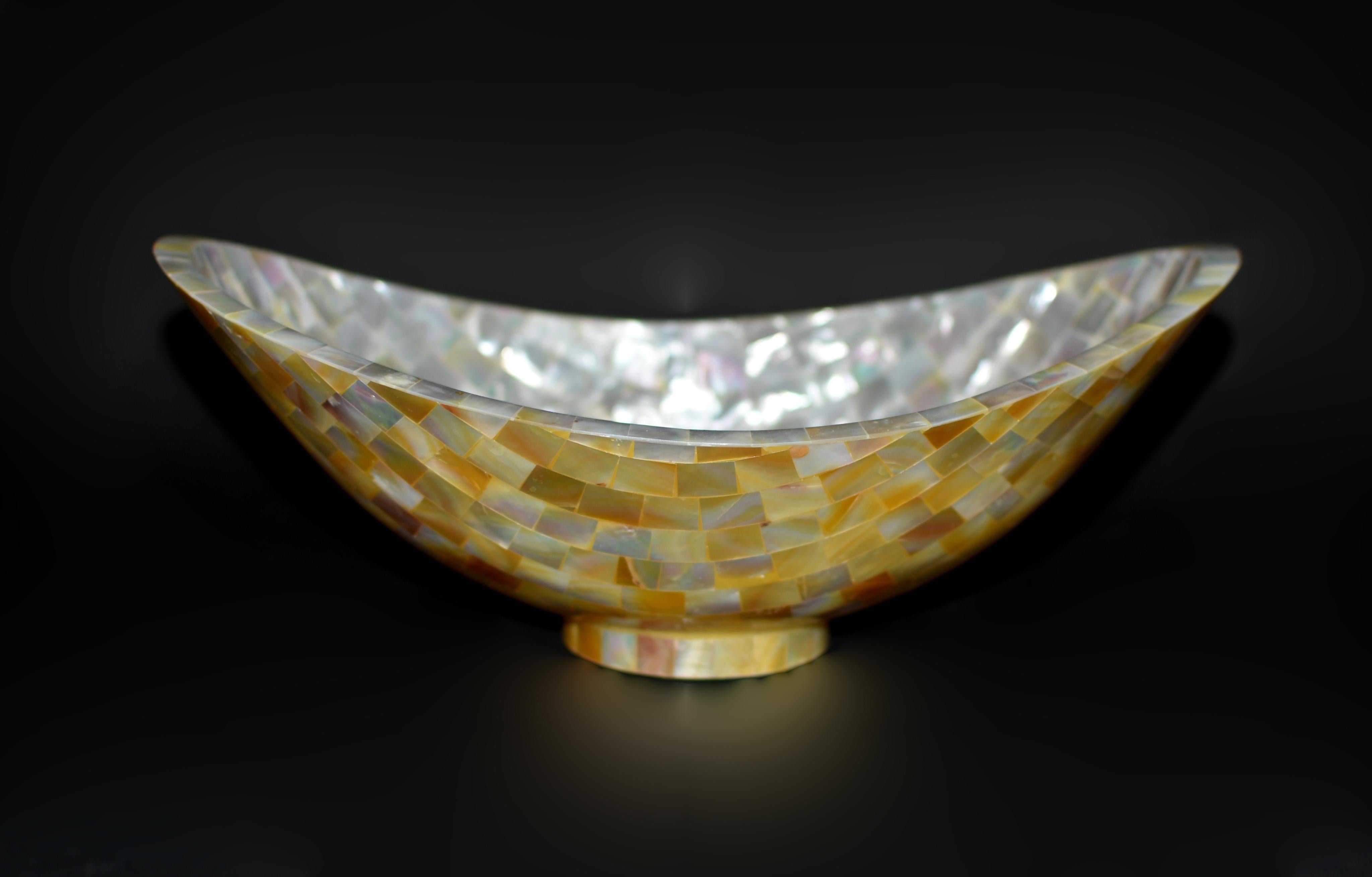 Embodying luxury, artistry and utility, this exquisite mother of pearl bowl is made with meticulous care to detail. Handmade with precision and masterful skill, each mosaic piece carefully selected from a beautiful natural shell, cut and fitted