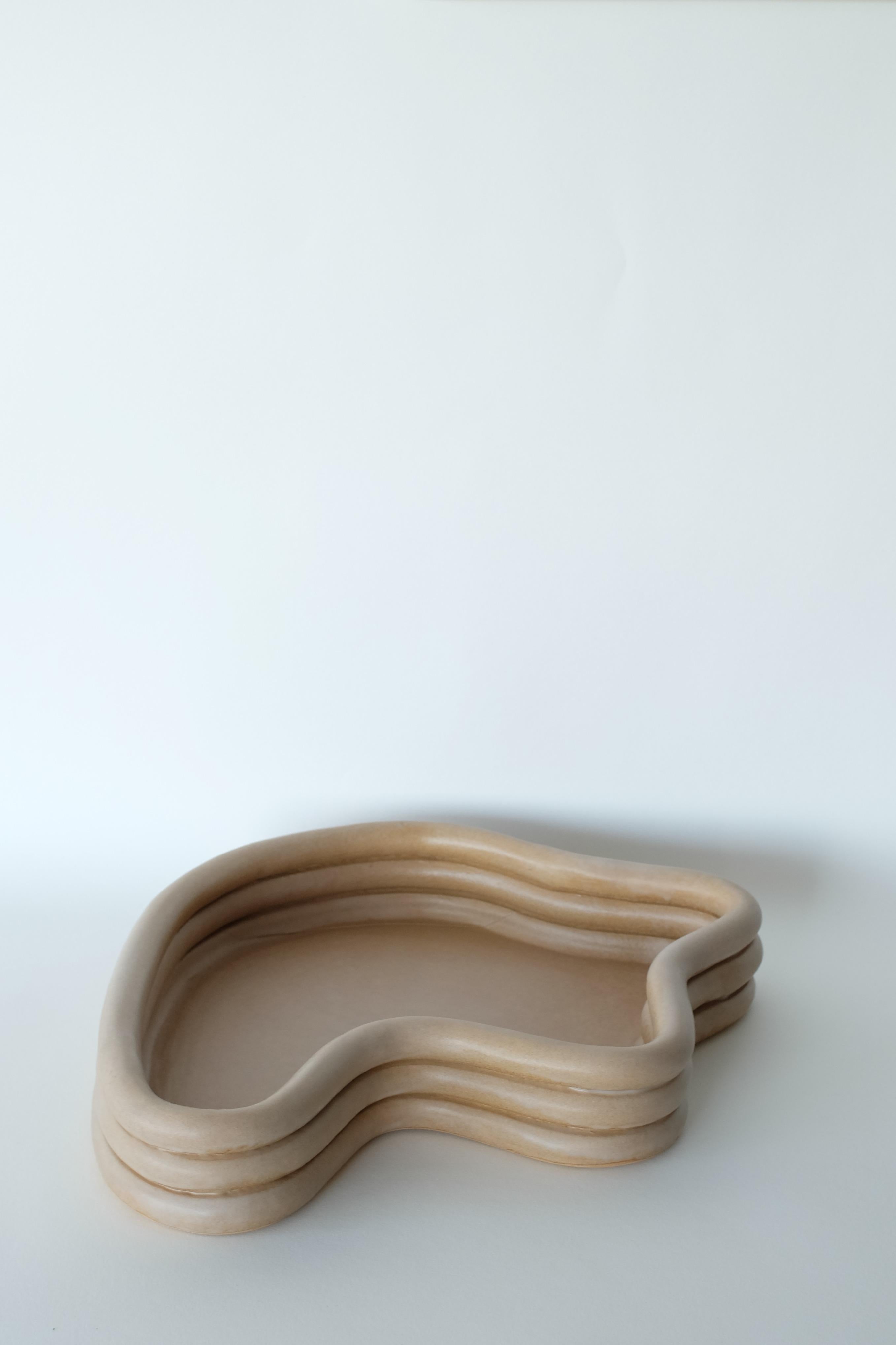Mother table centerpiece by Sophie Parachey
Dimensions: W 37 x D 32 x H 8 cm
Materials: Sand stoneware, mate sage glaze.

Inspired by extended stays in Central America, Sophie Parachey’s work questions transformation, the antagonism between the