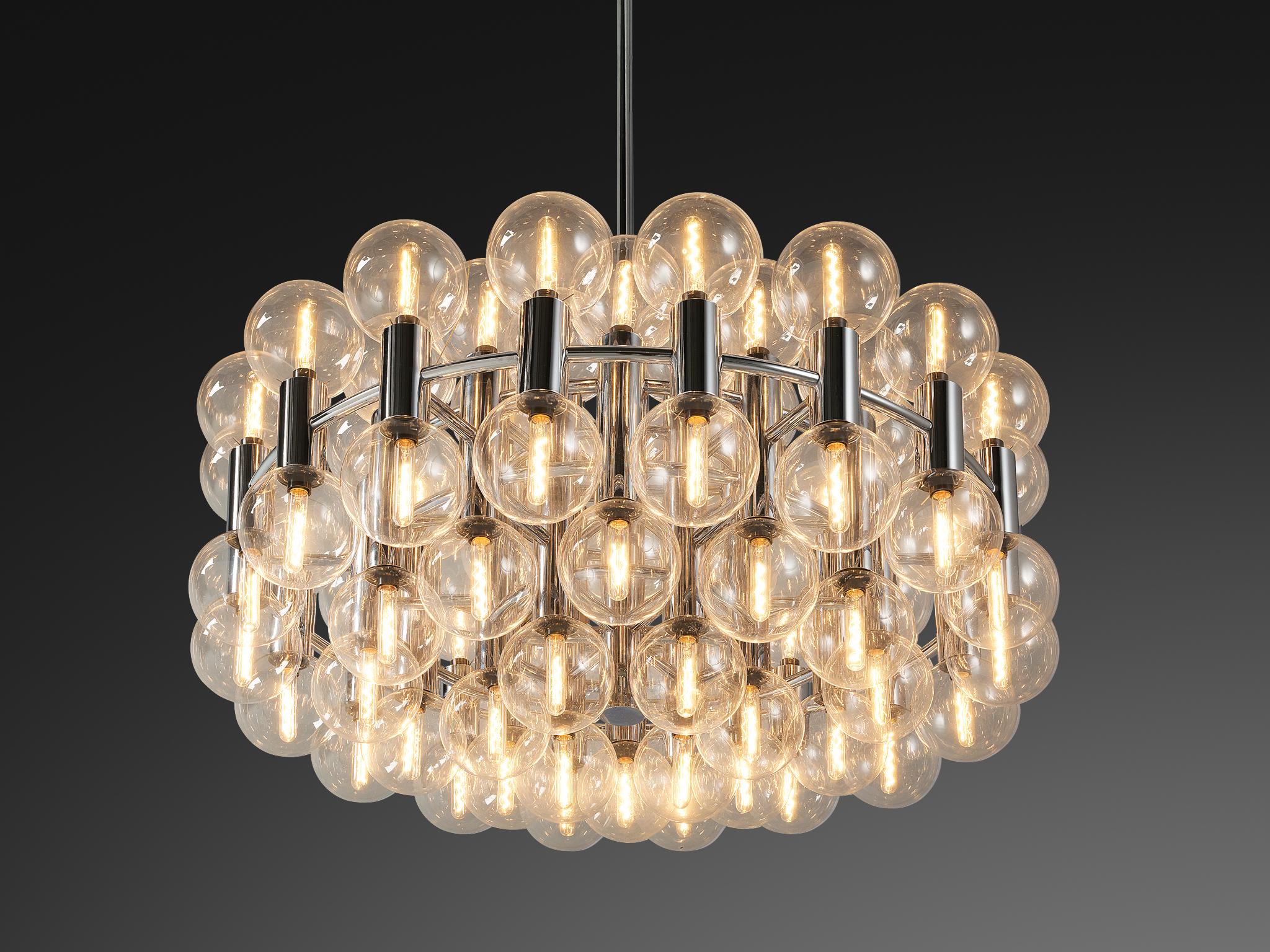 Motoko Ishii for Staff Leuchten, ´Sputnik´ chandelier, chrome, glass, Germany, ca. 1971. 

This magnificent 'Sputnik' chandelier is designed by the Japanese designer Motoko Ishii. It spreads the light of the impressive large amount of 72 spheres,
