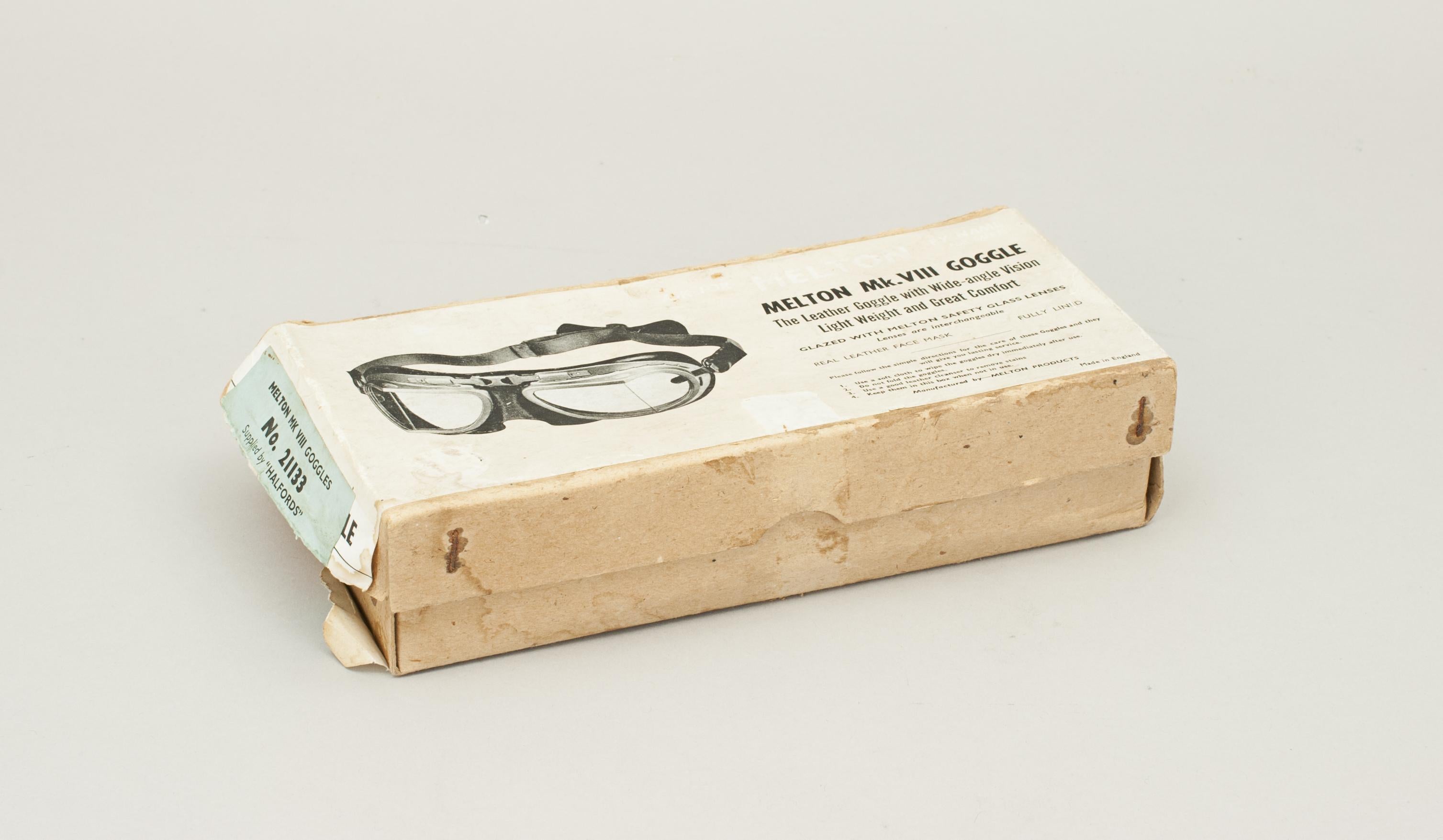 Melton Mk. VIII Goggles supplied by Halfords.
Pair of Melton goggles in good original condition and still in their original cardboard box. The goggles with padded soft brown suede leather facemask and adjustable nose-bridge. The silver painted