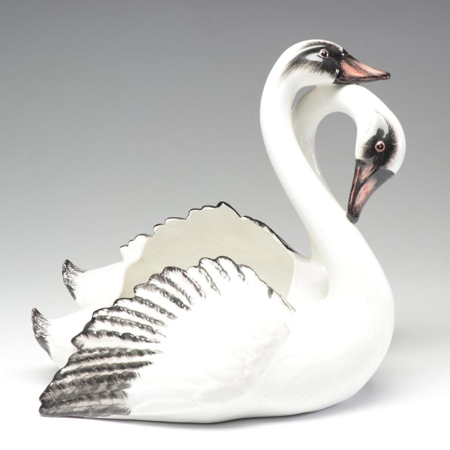 Mottahedeh hand painted porcelain planter in the form of a pair of embracing swans. Beautiful detail to the eyes and beaks of the two birds. Made in Italy. Can be used as a planter or would make a fantastic center piece for a formal dining table.