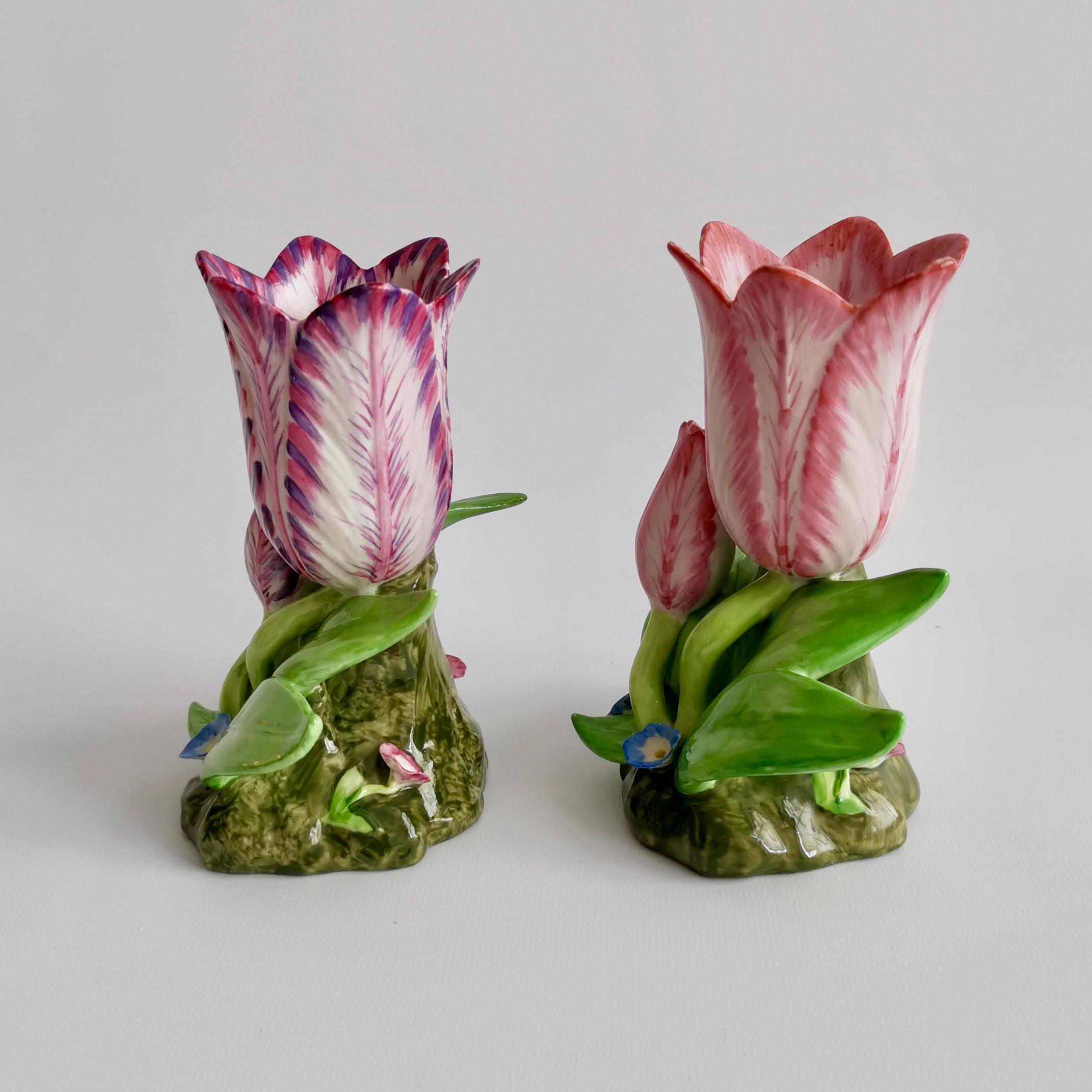 This is a beautiful pair of small tulip vases, originally from the early 19th century but reproduced by Mottahedeh in the second half of the 20th century.

These tulip vases were popular in the early 19th century and were made in pottery by