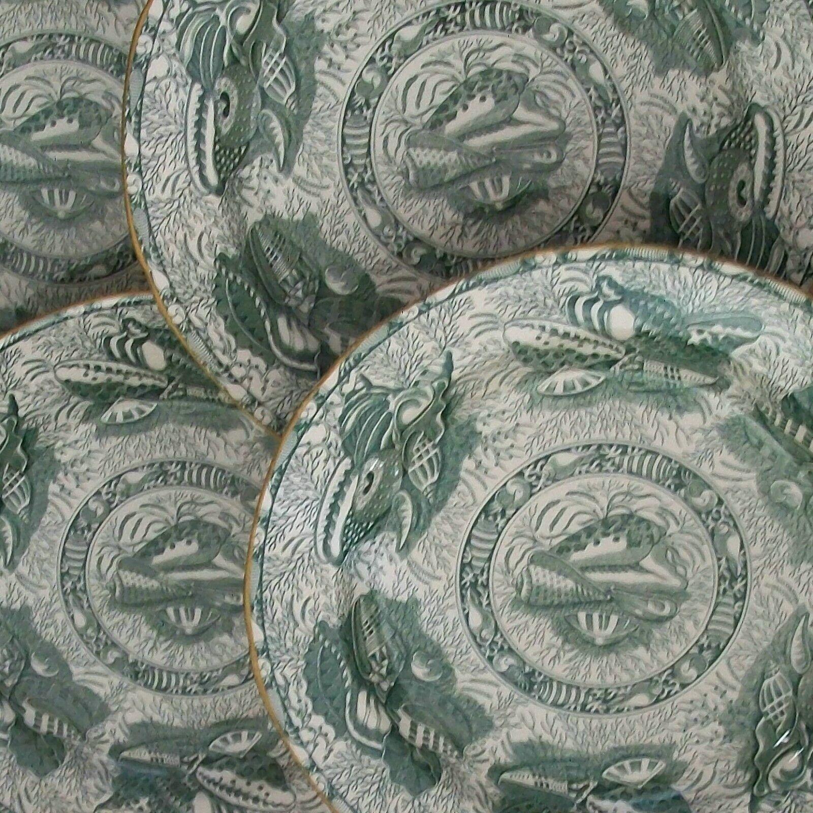 MOTTAHEDEH - 'Torquay' - Winterthur Museum Reproduction - Set of four green transfer decorated dinner plates - each plate featuring a variety of shells - after an early Staffordshire design, circa 1820 - simple gold border / edge - signed on the