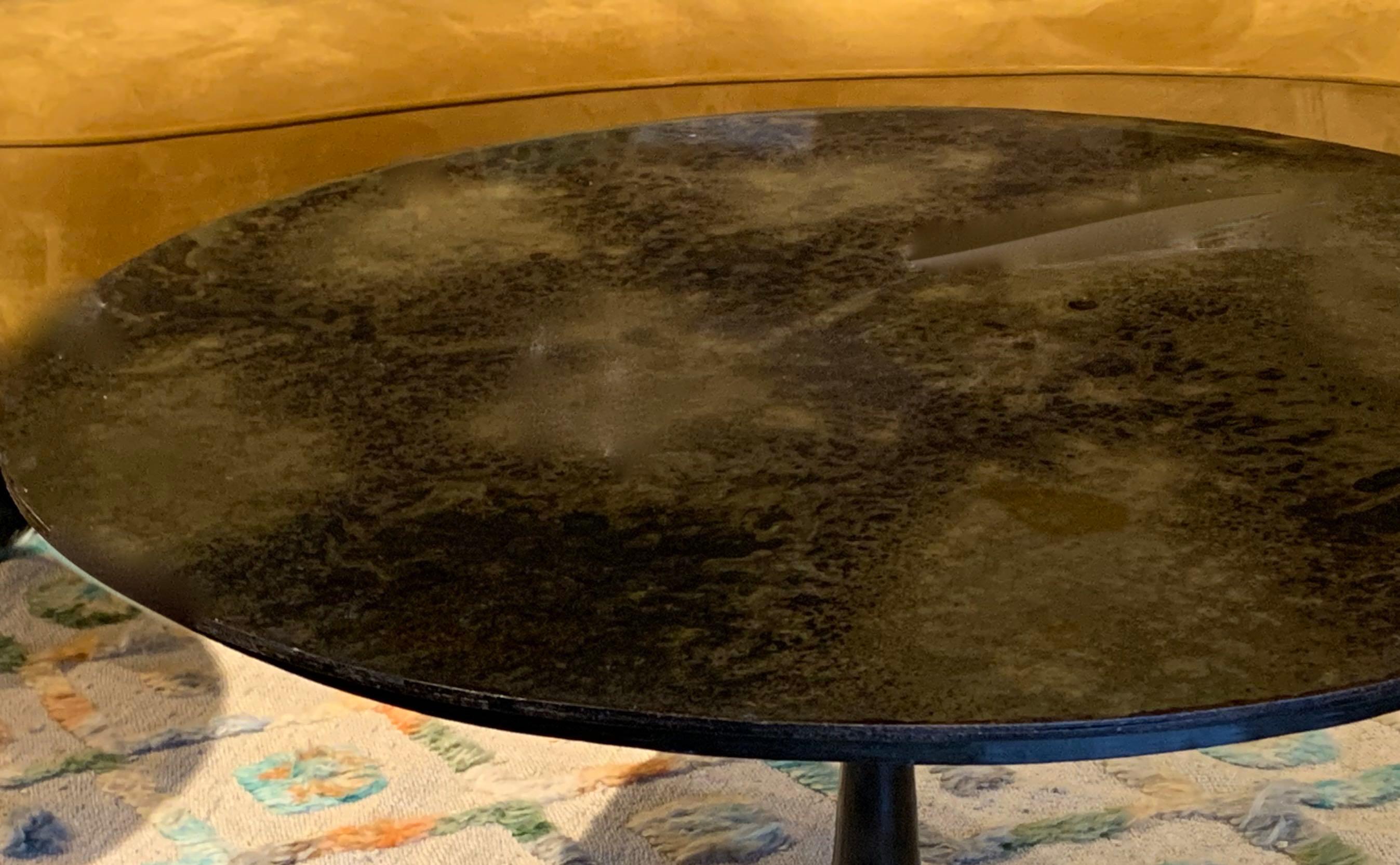Contemporary Indian coffee table with mottled bronze top and pedestal base
Same design also available as a side table. (F2700) and as a cocktail table (F 2630).


