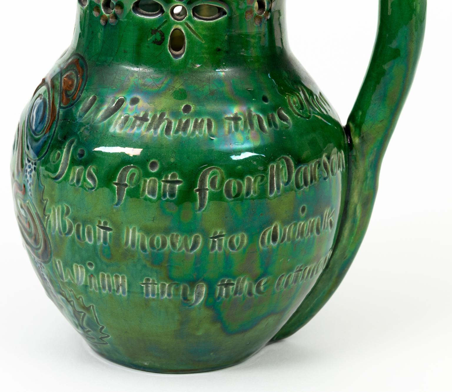Motto puzzle jug by CH Brannam. Made in Barnstaple, North Devon, circa 1897. The ditty around the jug says 