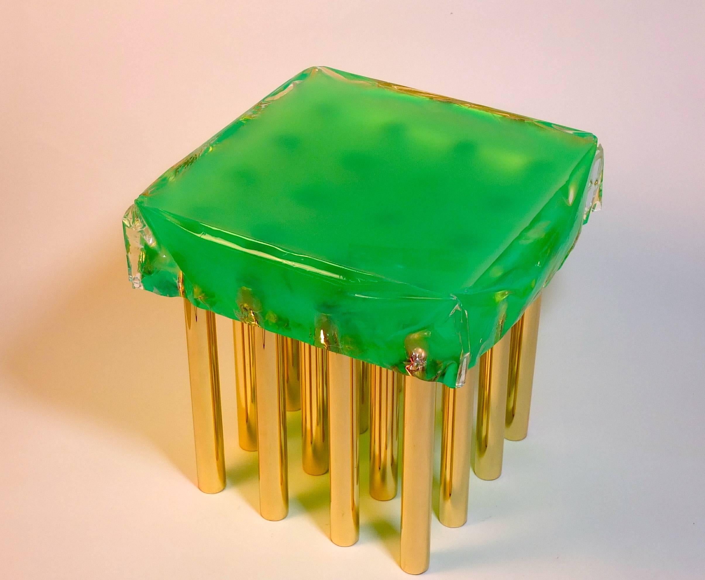 'Mou' coffee table in fluorescent green plexiglass with brass legs designed and produced by Studio Superego.

Biography
Superego Editions was born in 2006, performing a constant activity of research in decorative arts by offering both contemporary