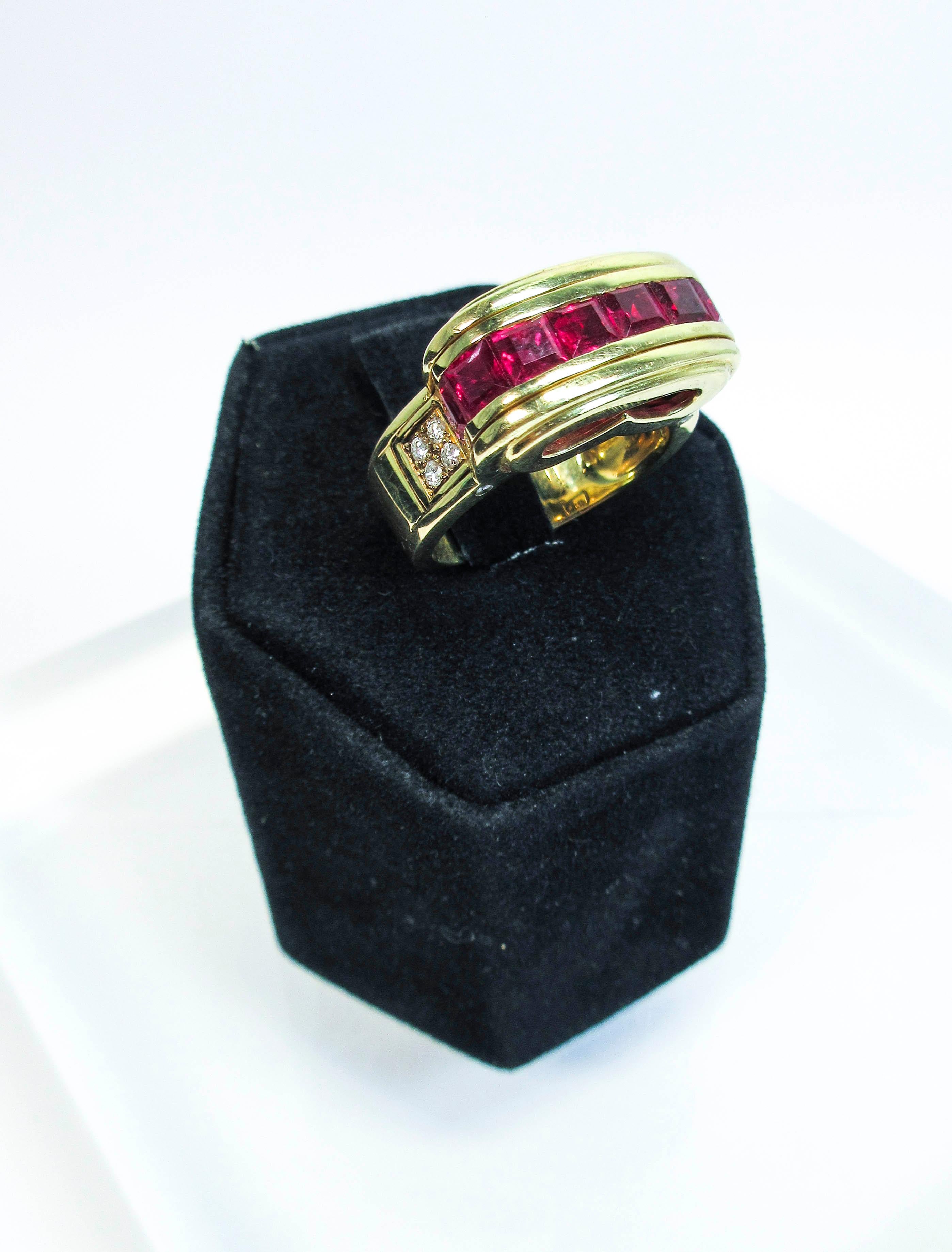 This wonderful Mouawad design is composed of 18kt yellow gold. The setting features a raised design with ruby center stones and side diamond accents. There are approximately 0.14cts of VS/F diamonds. Please feel free to ask us any questions you may