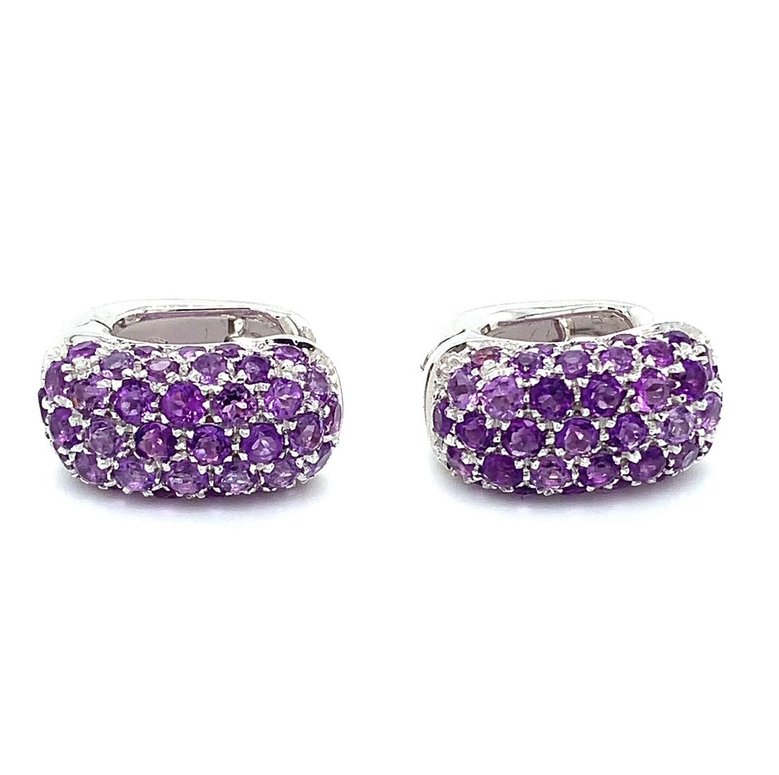 Try these purple amethyst stone is set in a pave setting style, surrounded by its natural beauty of the gemstone. The earrings are made of 18k white gold, giving them a luxurious and timeless appeal. The clip-on closure makes them easy to wear, and