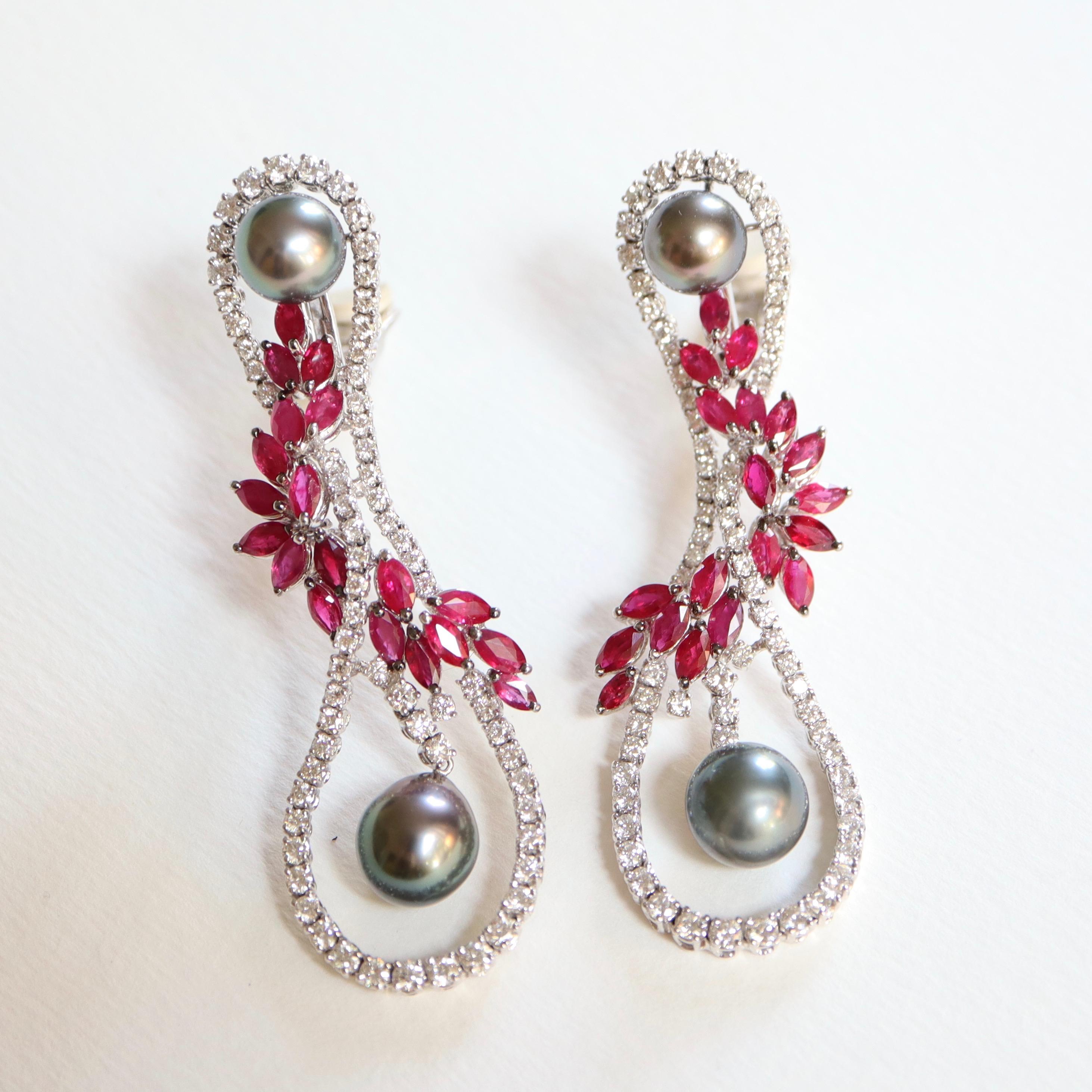 MOUAWAD Dangle Earrings Pattern representing a 8 in 18 carat white Gold entirely set with Brilliant Cut Diamonds, intertwined with Shuttle-cut Rubies forming a foliage Garland. A Grey Tahitian Pearl in the Center at the Top of the Earrings as well