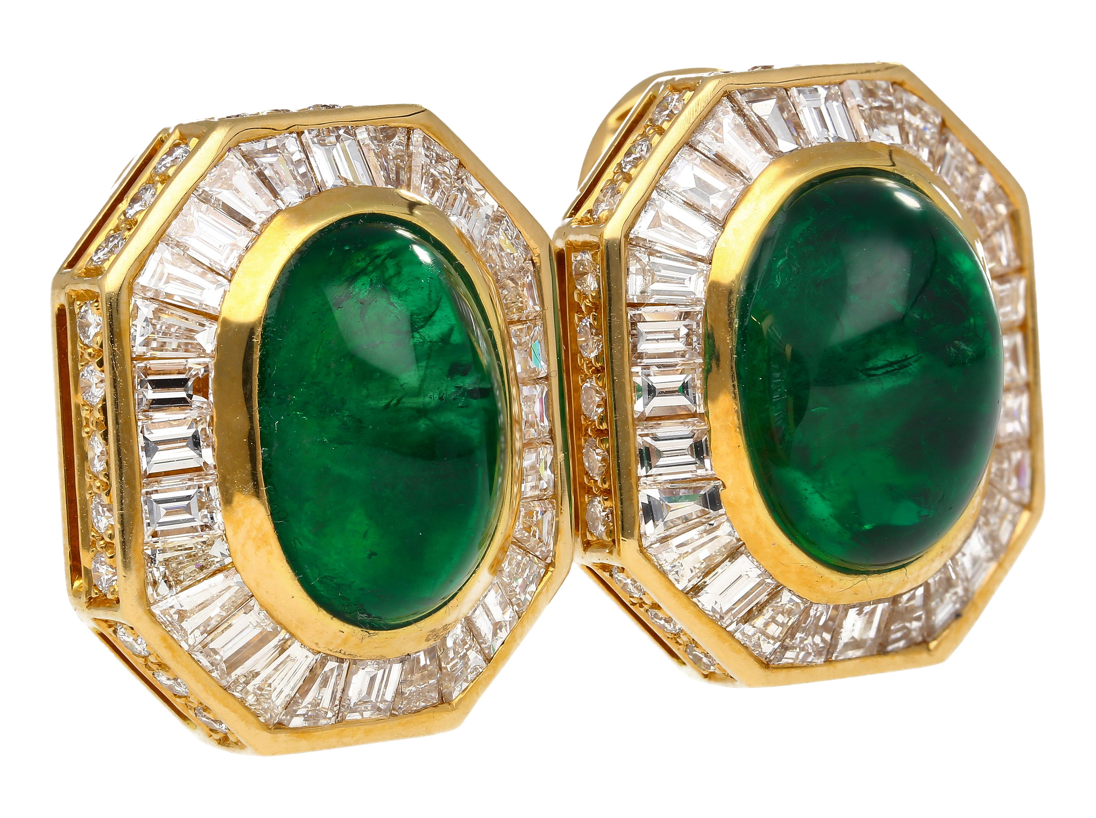 GRS-certified 17.3 carat total cabochon cut Zambian emerald and diamond clip-on earrings. Featuring 4.71 carats of baguette cut diamonds forming a halo around the bezel set center stone. The emeralds, 6.63 carats and 5.96 carats, are a certified