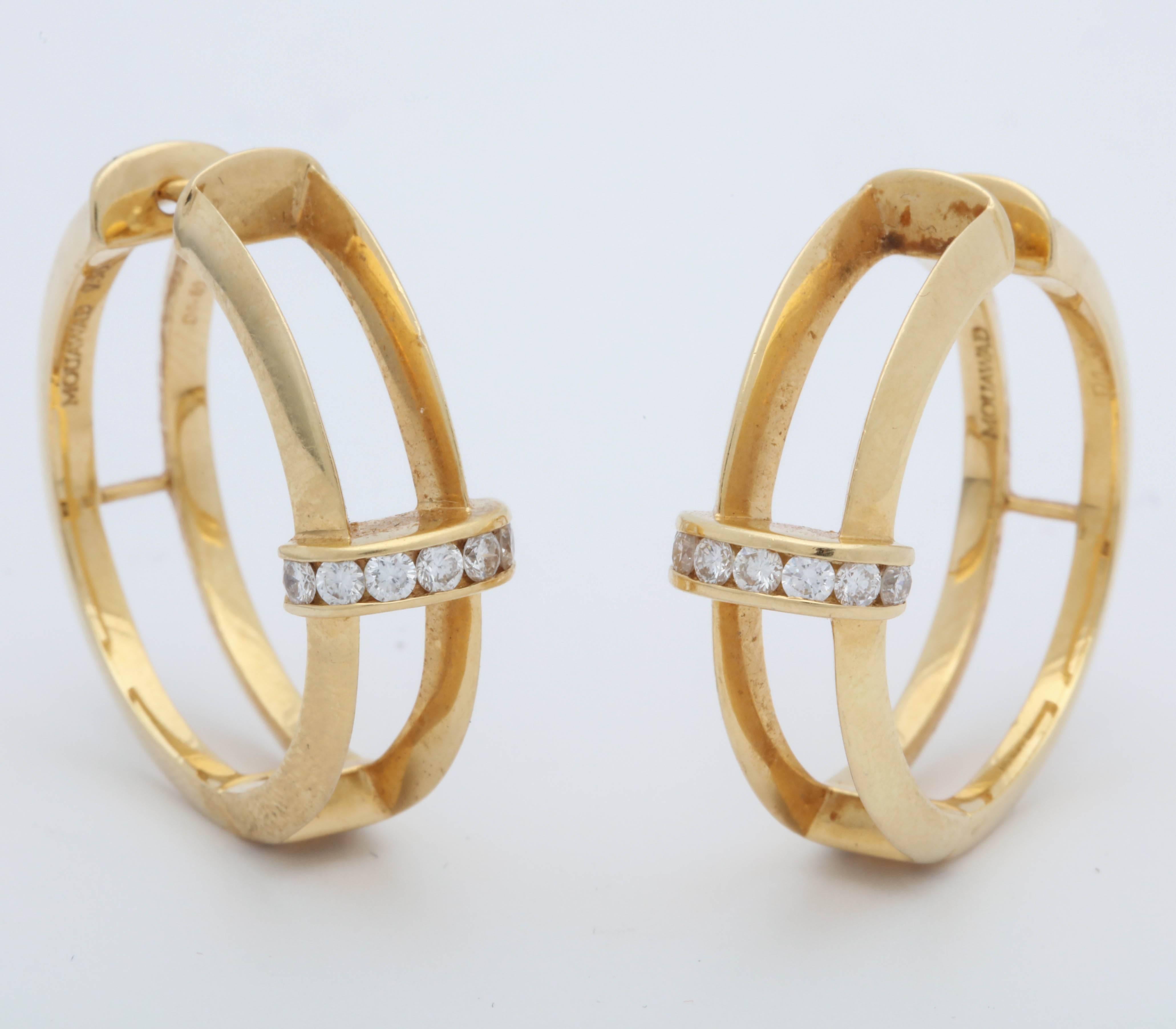 One Pair Of Ladies 18kt Yellow Gold Hoop Earrings Designed With A Knife Edged Double Bar Open Look And Embellished With 16 Full Cut Very High Quality Invisibly Set Diamonds Weighing .80 Cts Total Weight Approximately Signed By Mouawad And Made In