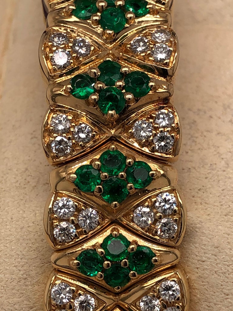 An extraordinarily, unique piece that we have never seen another of its kind. This rare, women’s convertible watch and bracelet is handcrafted by the Maison of Mouboussin. It is made of 18K yellow gold and encrusted with diamonds and emeralds. This