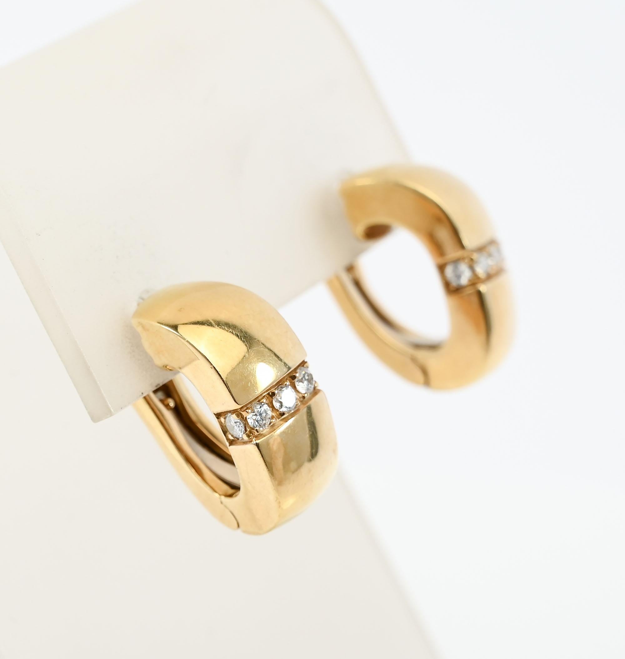 Tailored Mauboussin half hoop earrings with a touch of bling. Five diamonds are set horizontally on each earring and curved around the sides to give some sparkle. The backs are hinged to accomodate the posts.
