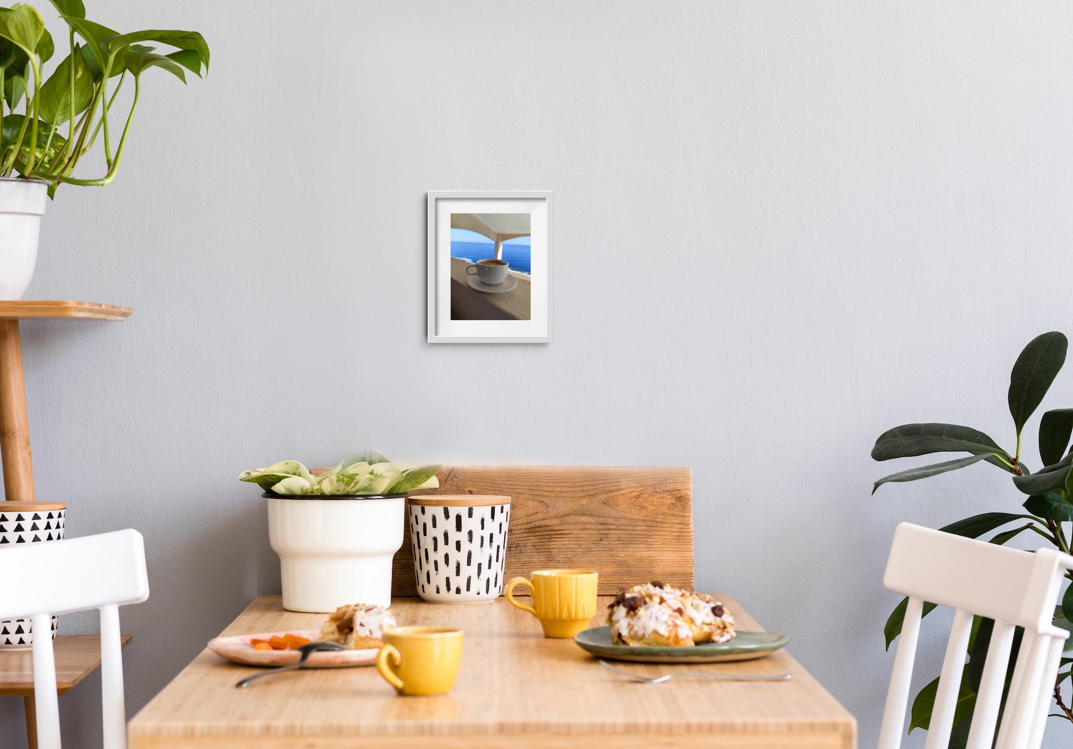 This contemporary minimalist still-life image, documenting a fleeting moment of calm, was taken by French artist Natalya Mougenot during her journey through Italy. A single cup of espresso sits in quiet contrast to the vast expanse of blue sky and