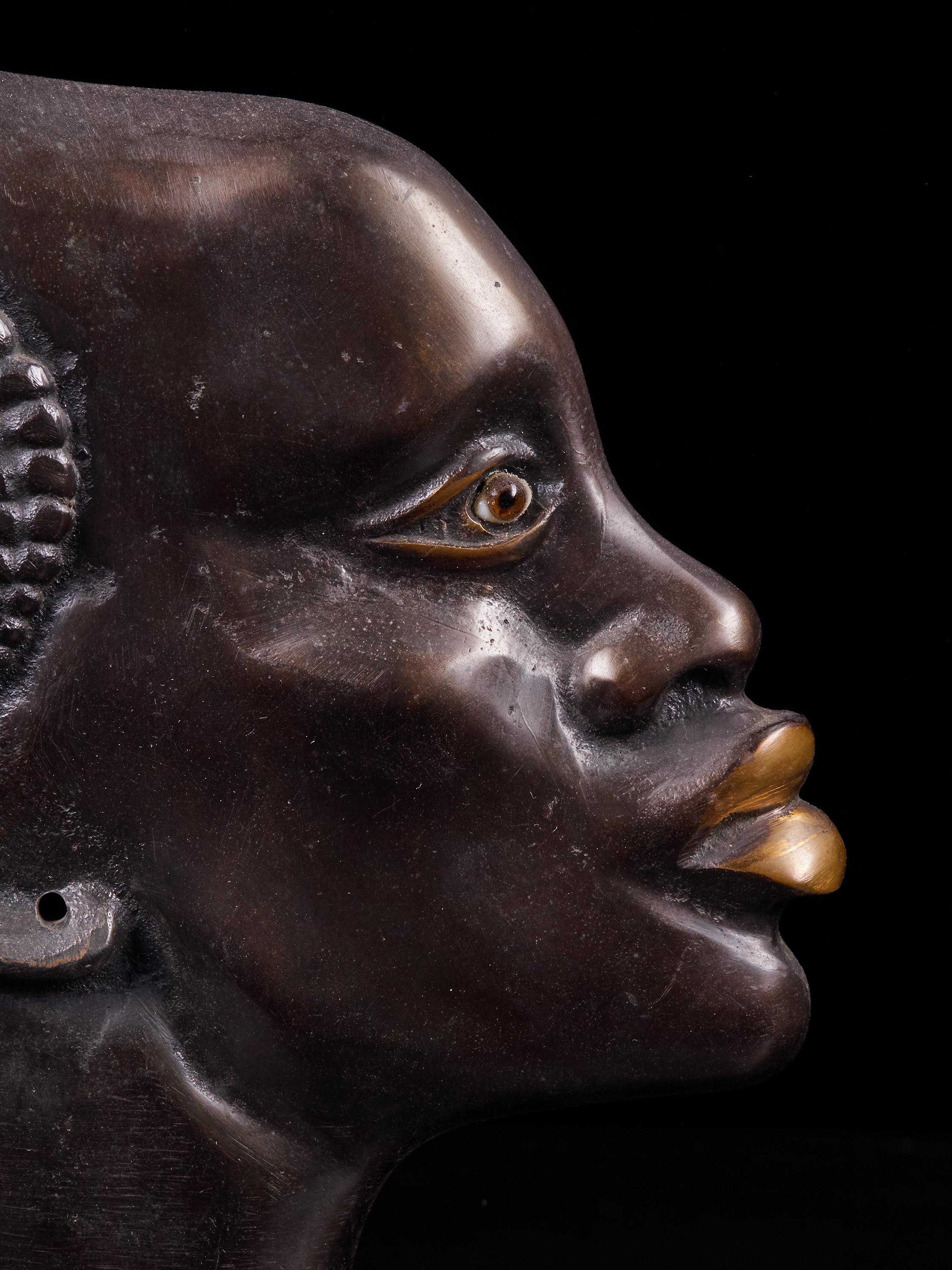 20th Century Moulded Copper Alloy Head of an African Figure with a Stone Base