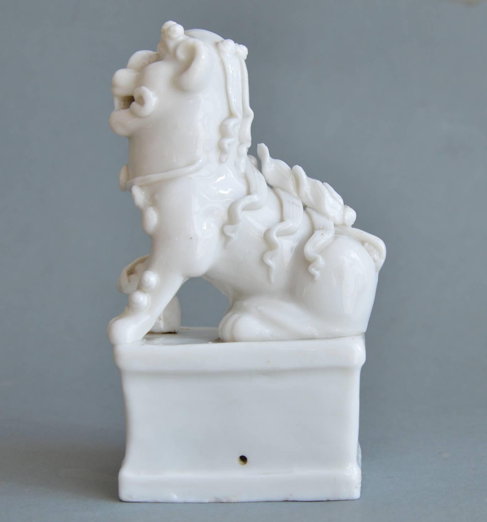 Chinese Moulded Miniature Blanc de Chine Porcelain Figurine of a Foo Lion Kangxi