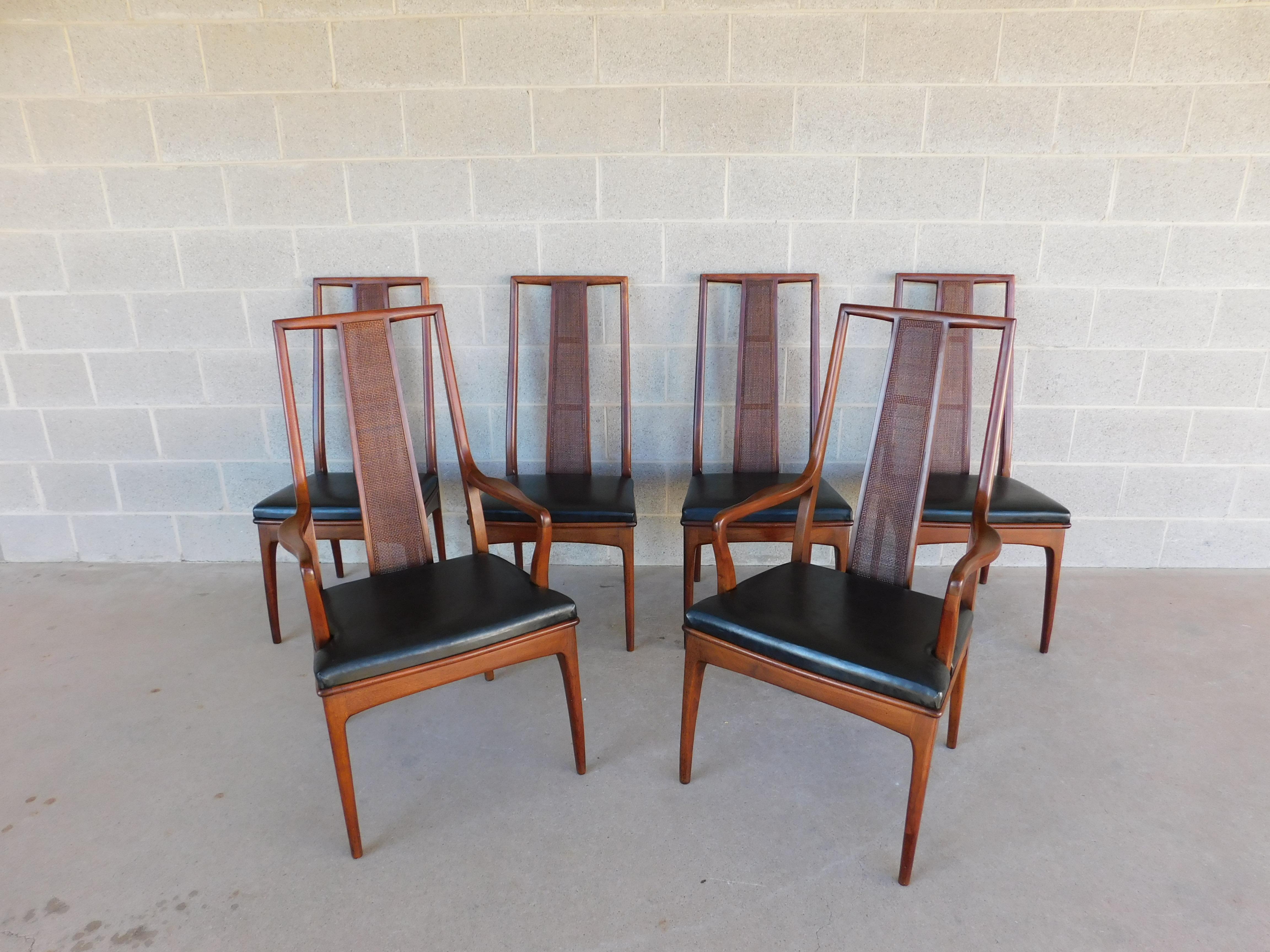 Mount Airy Chair Co. Mid Century John Stuart Walnut Dining Chairs - Set of 6

Set of 6 Walnut Chairs, Original Finish, Contoured Back Design with Center Tight Caning, Original Vinyl Black Seat Cushion in Very Good Original Condition. 4 side and 2