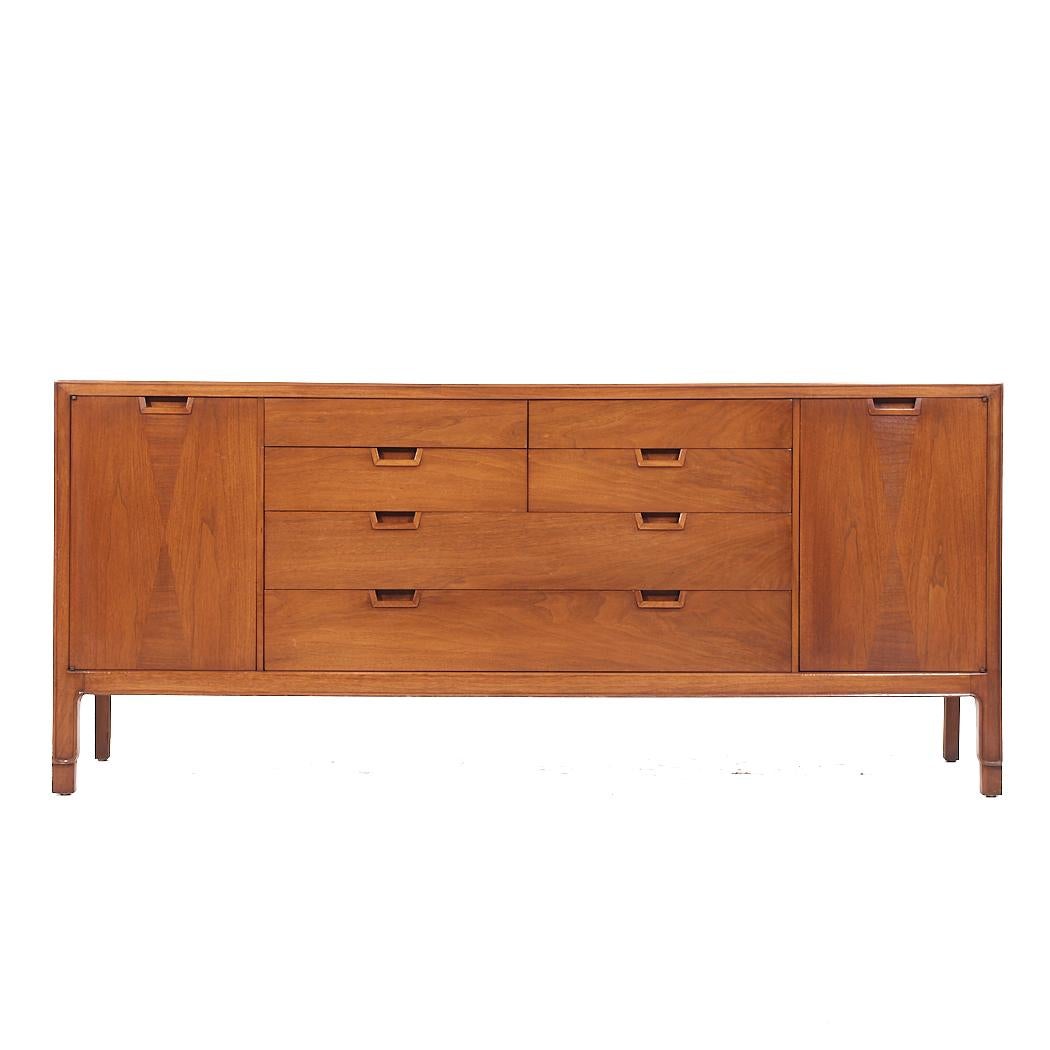 Mount Airy Janus Mid Century Walnut 14 Drawer Lowboy Dresser

This lowboy measures: 72 wide x 19 deep x 31.5 inches high

All pieces of furniture can be had in what we call restored vintage condition. That means the piece is restored upon purchase